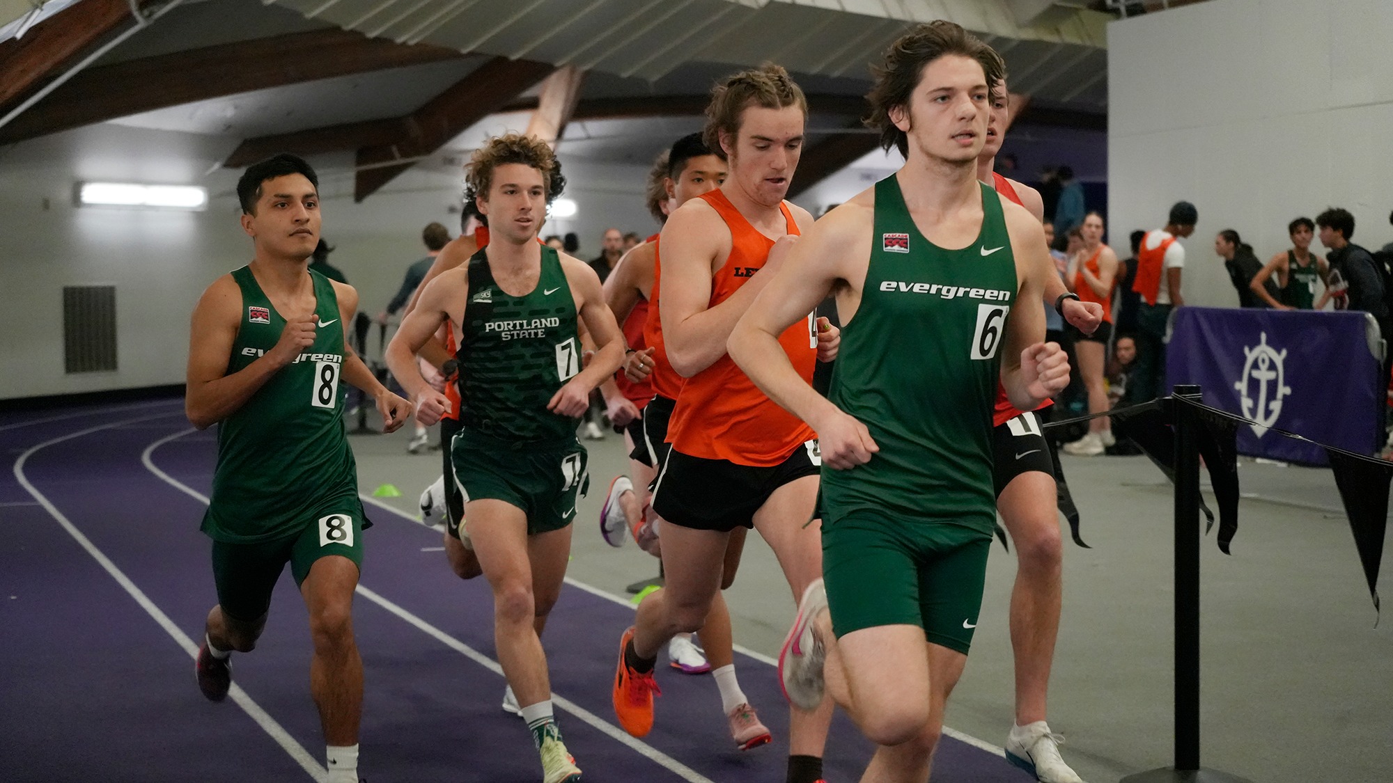 Evan Williams (right) and Osvaldo Calderon (left) run indoors for the Geoducks.