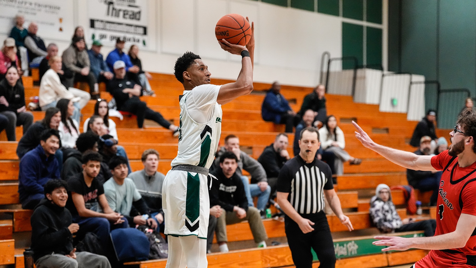 Kenzel Massey takes an outside shot for the Geoducks.