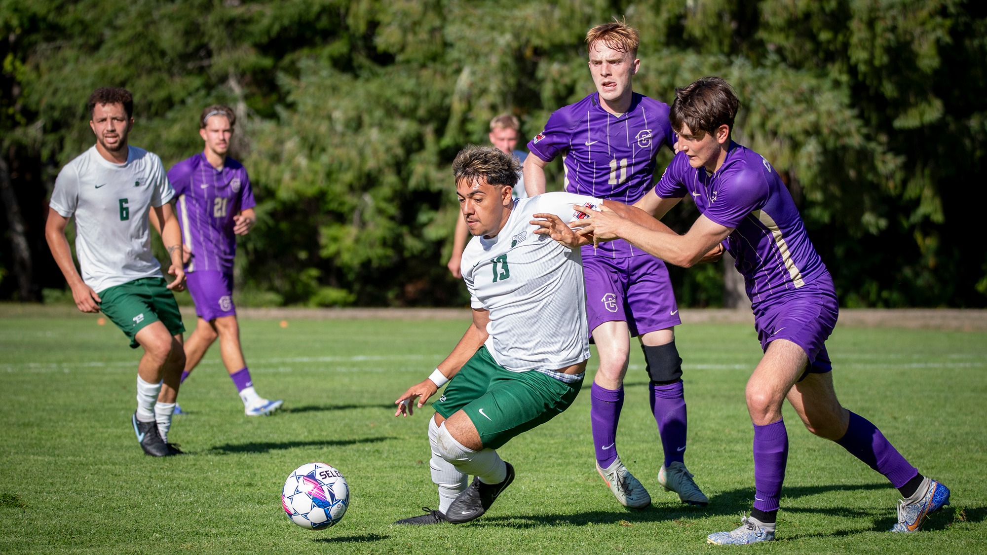 Anthony Diaz keeps possession for Evergreen.