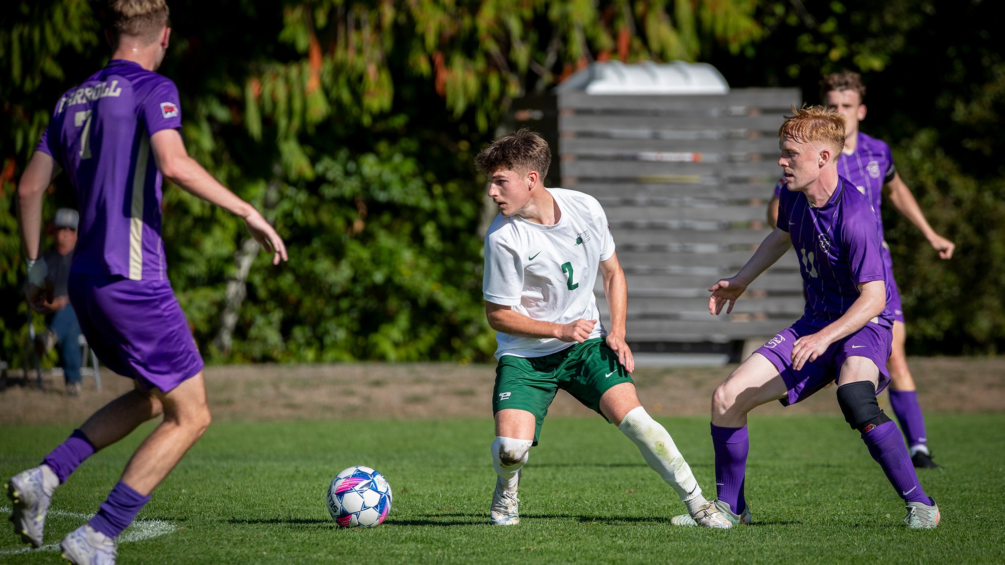 Walt Nichols turns to keep possession of the ball.