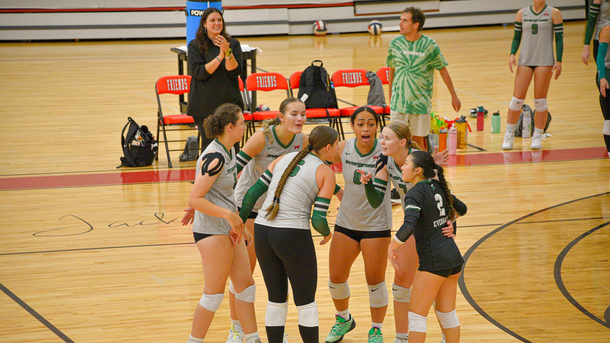 The Geoducks huddle on the court during the Friends Invitational