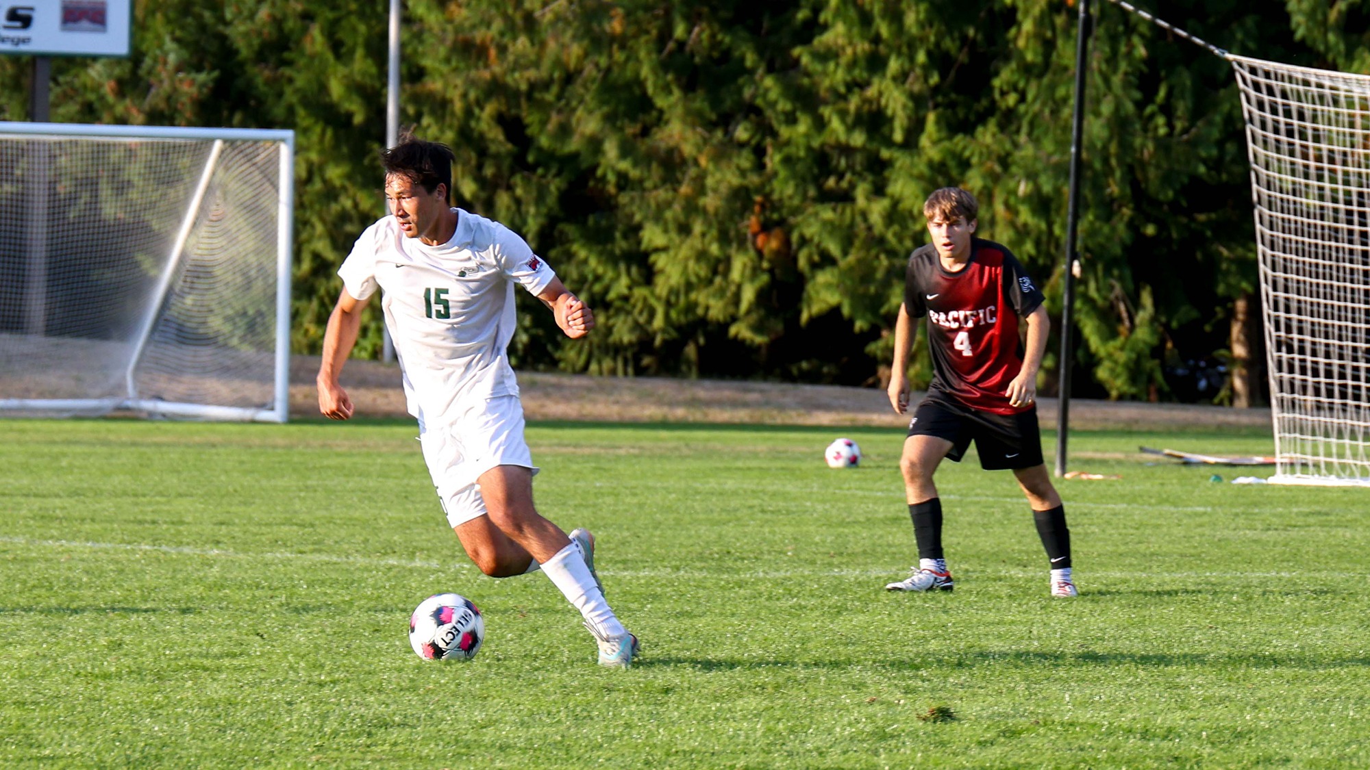 Brock Larsen controls the ball for Evergreen.