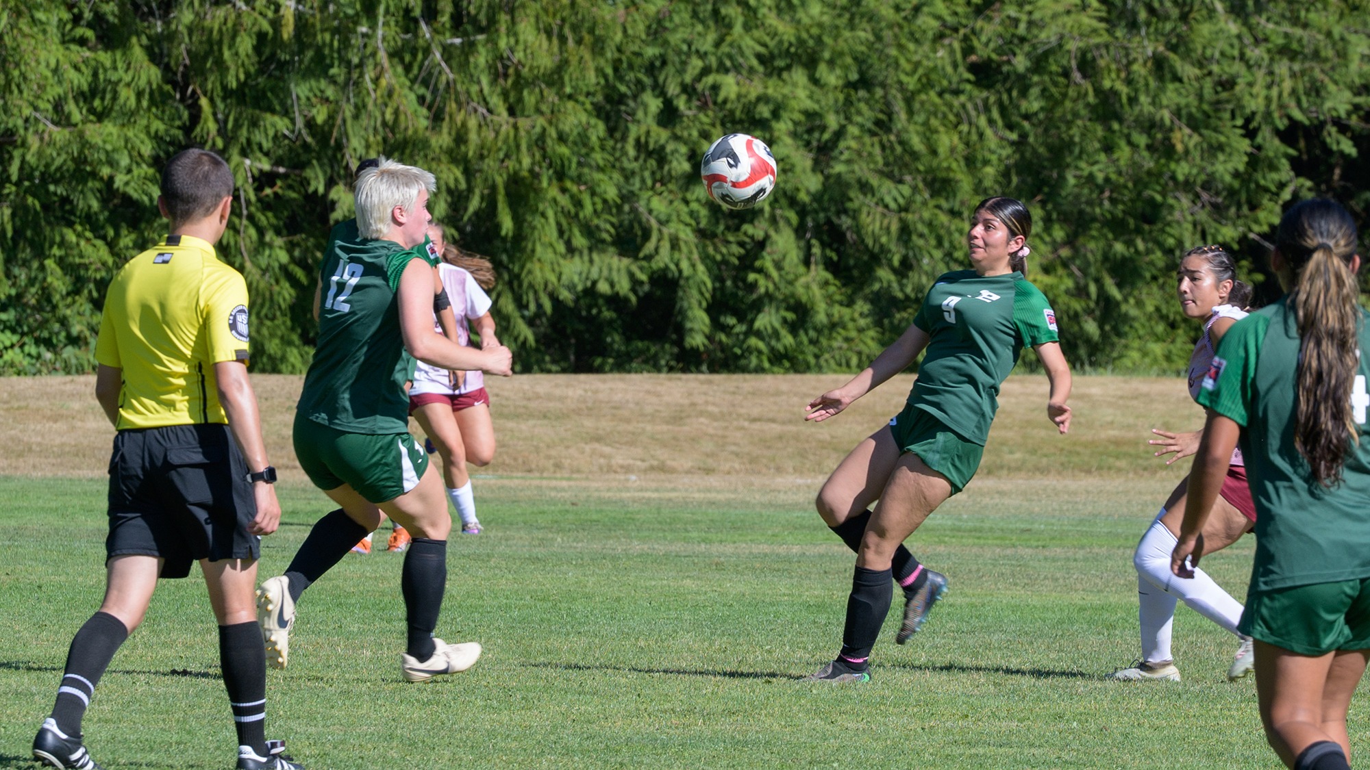 Gabriela Paniagua (#9) is ready to receive the ball.