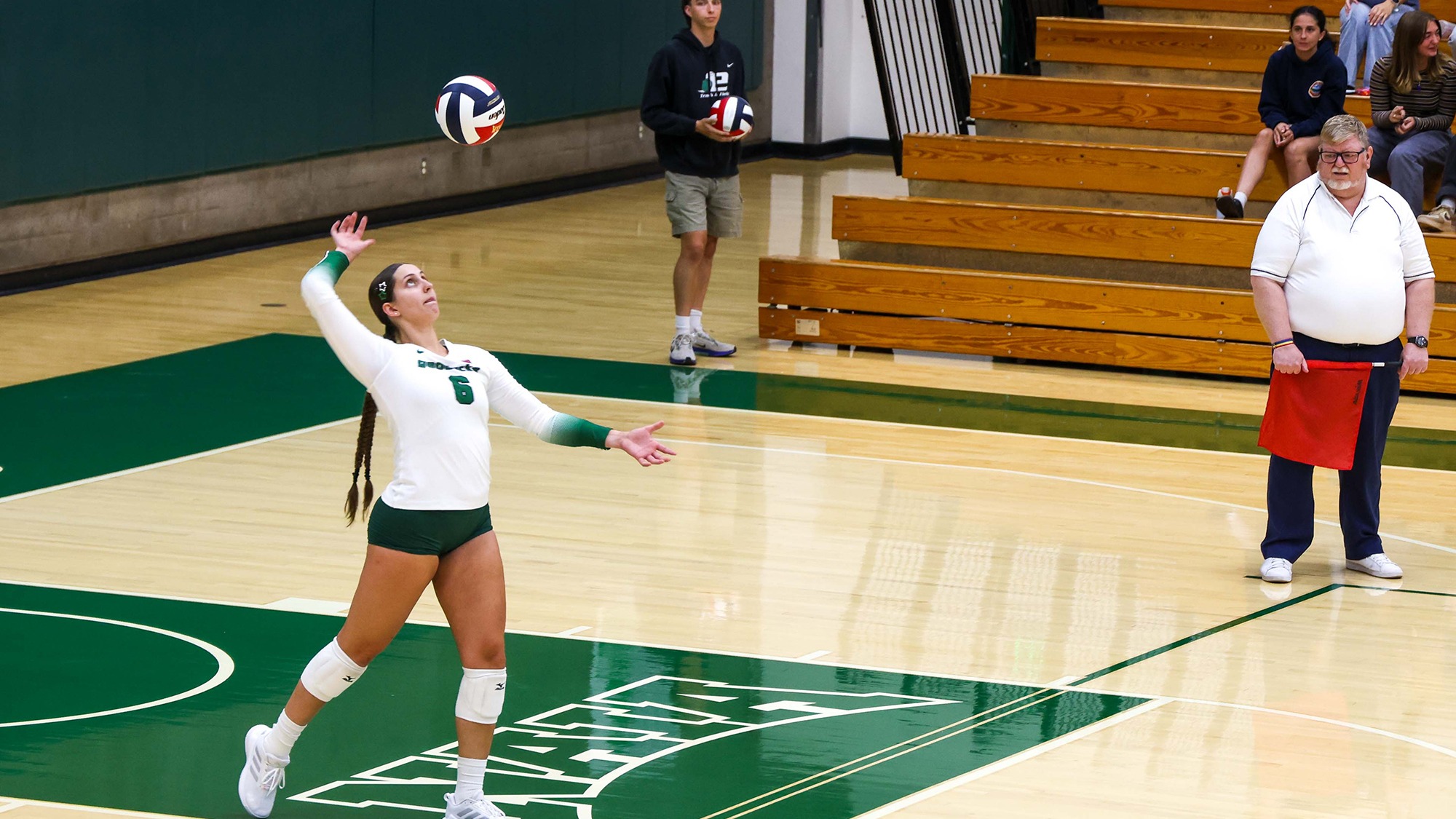 Sophia Scroggins serves the ball for the Evergreen Geoducks.