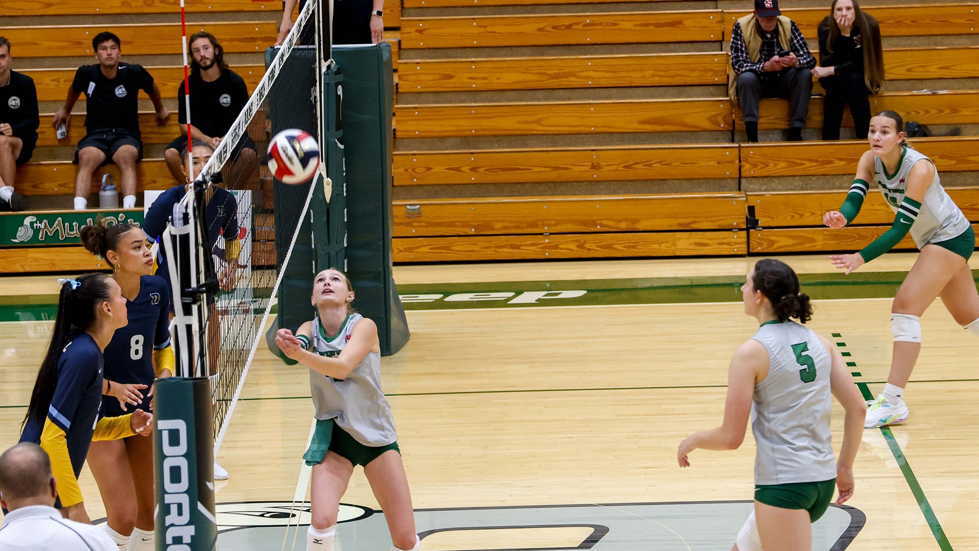 Evergreen setter Riley Mangan digs up the ball for the Geoducks.