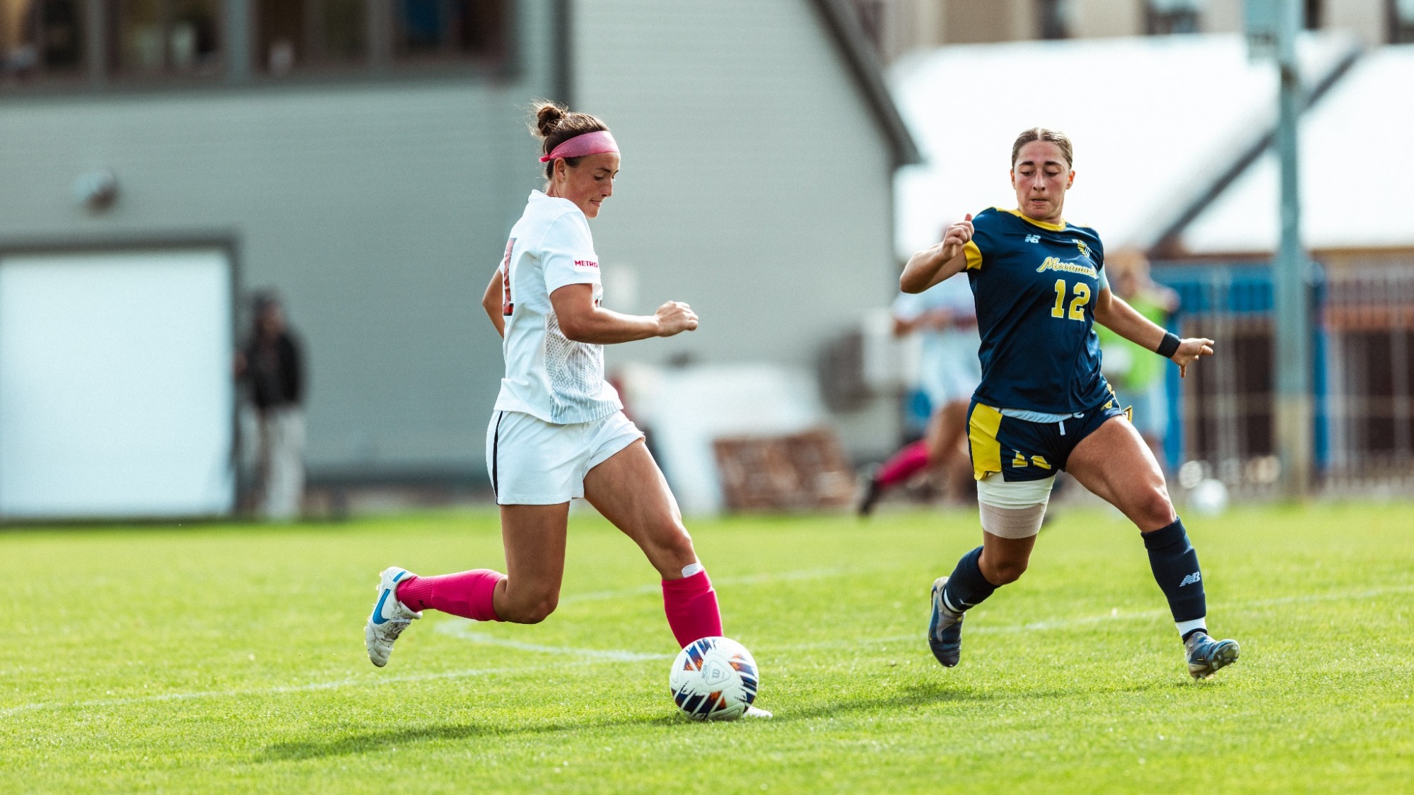 McMahon dribbles the ball against Merrimack