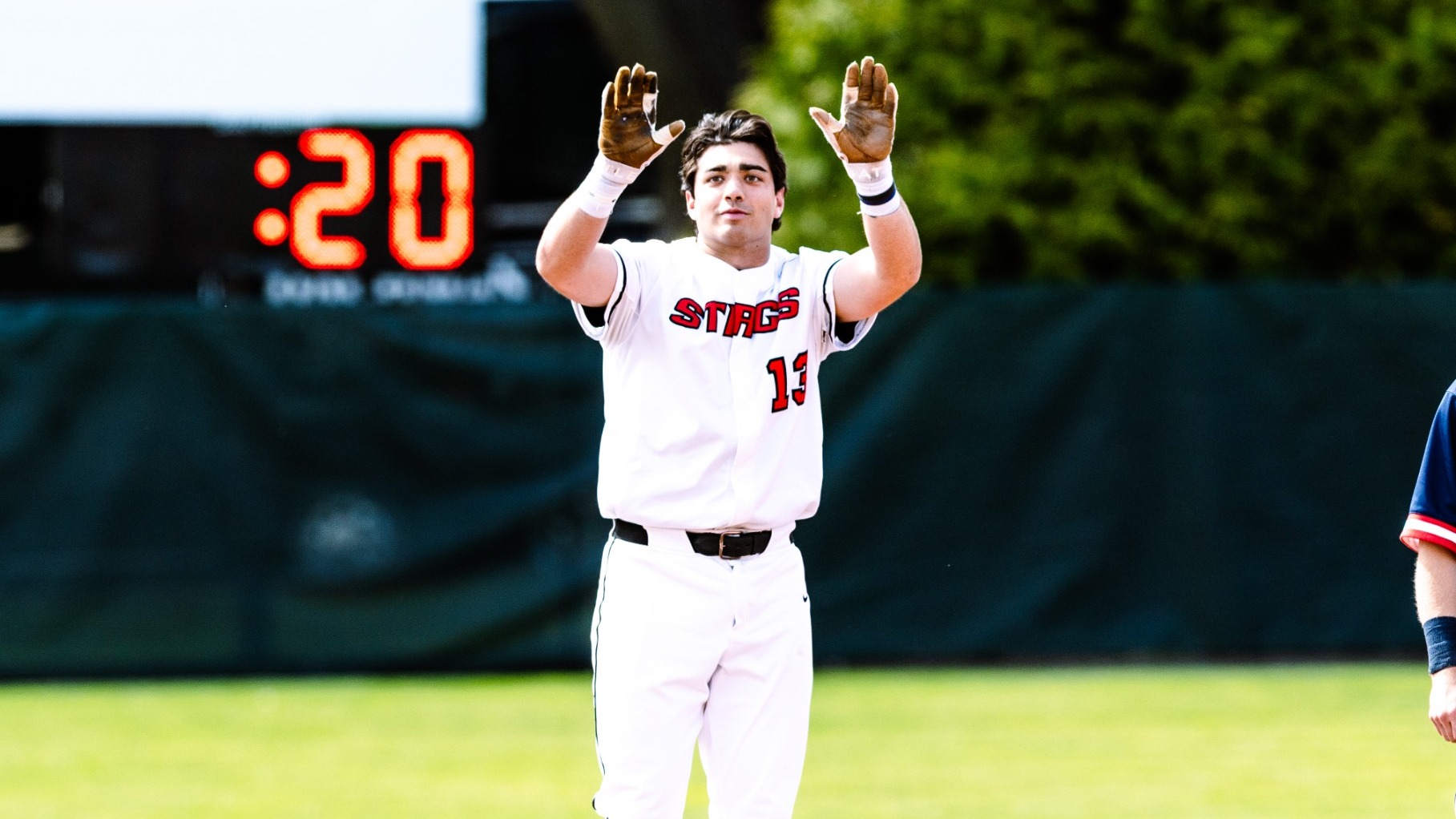 Scanlan celebrates at second base