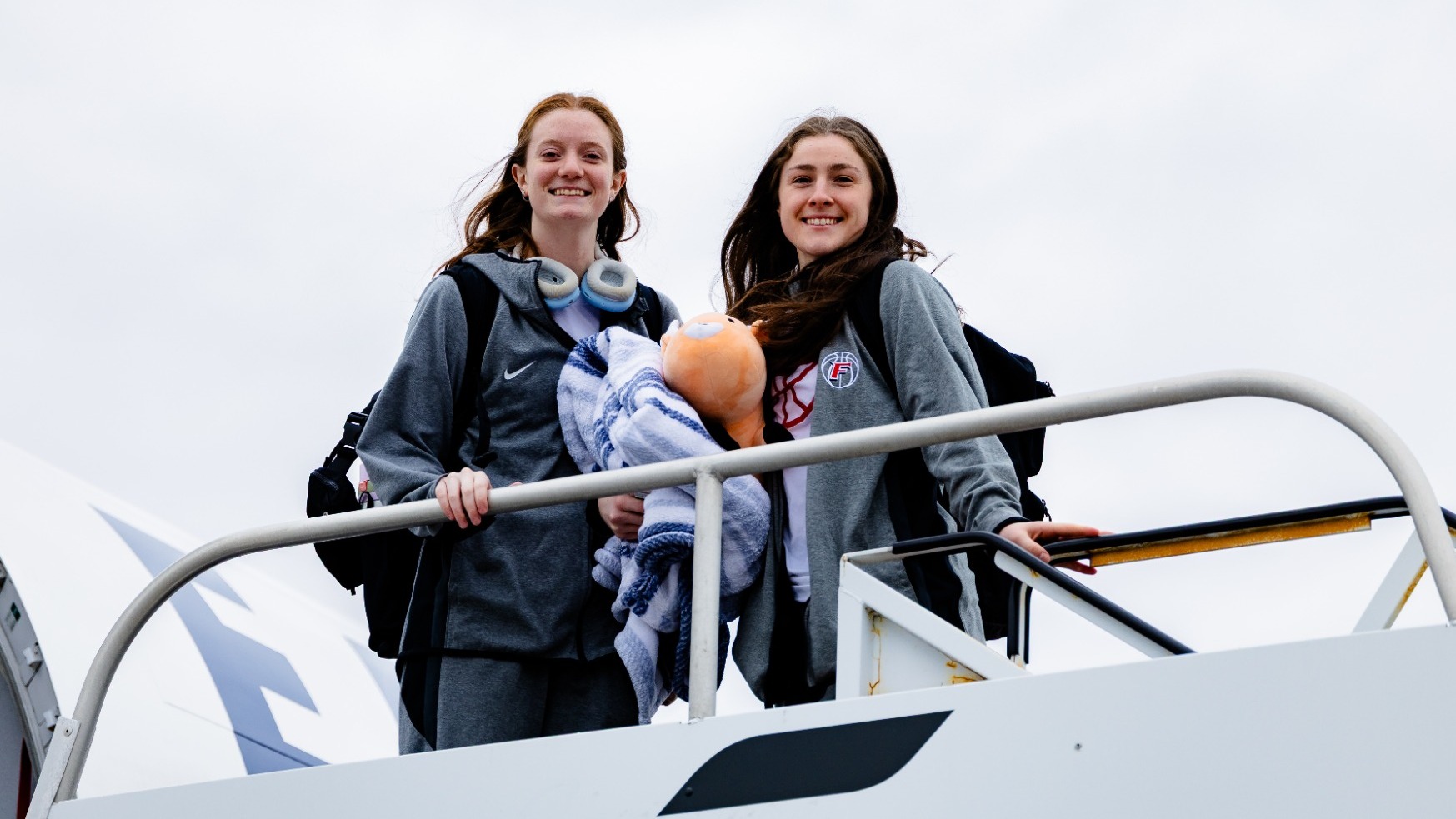 Huerter and L'Amoreaux boarding plane