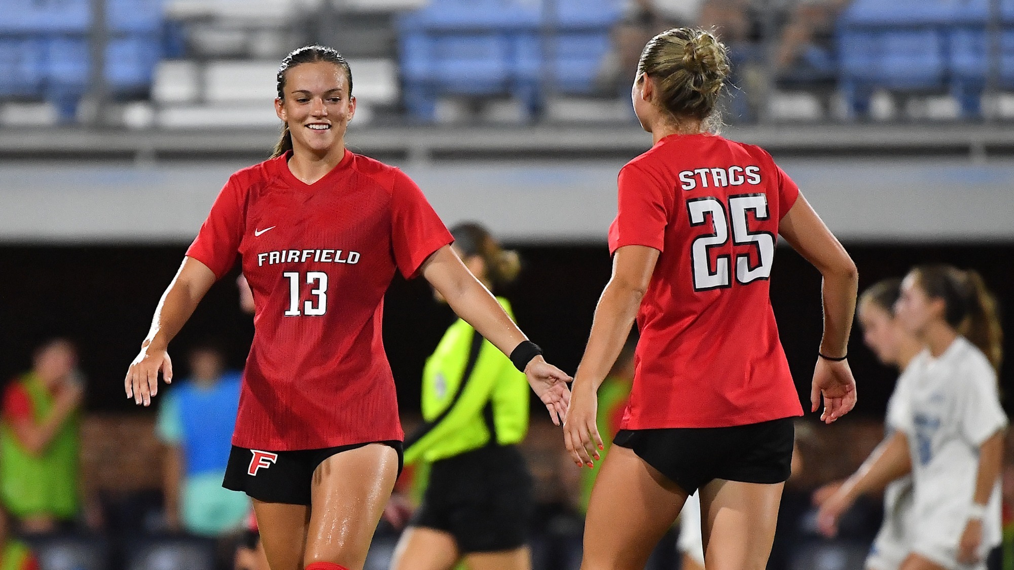 Kennedy enjoys a high five with a teammate
