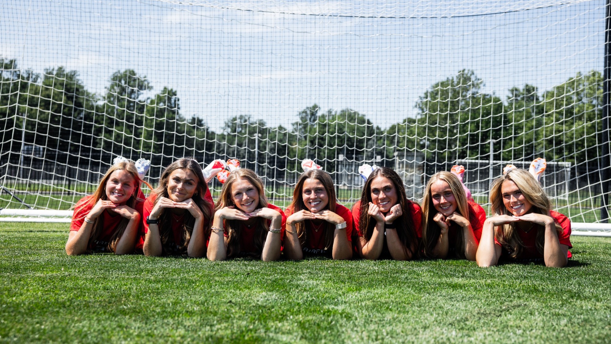 Seniors of women's soccer pose during media day