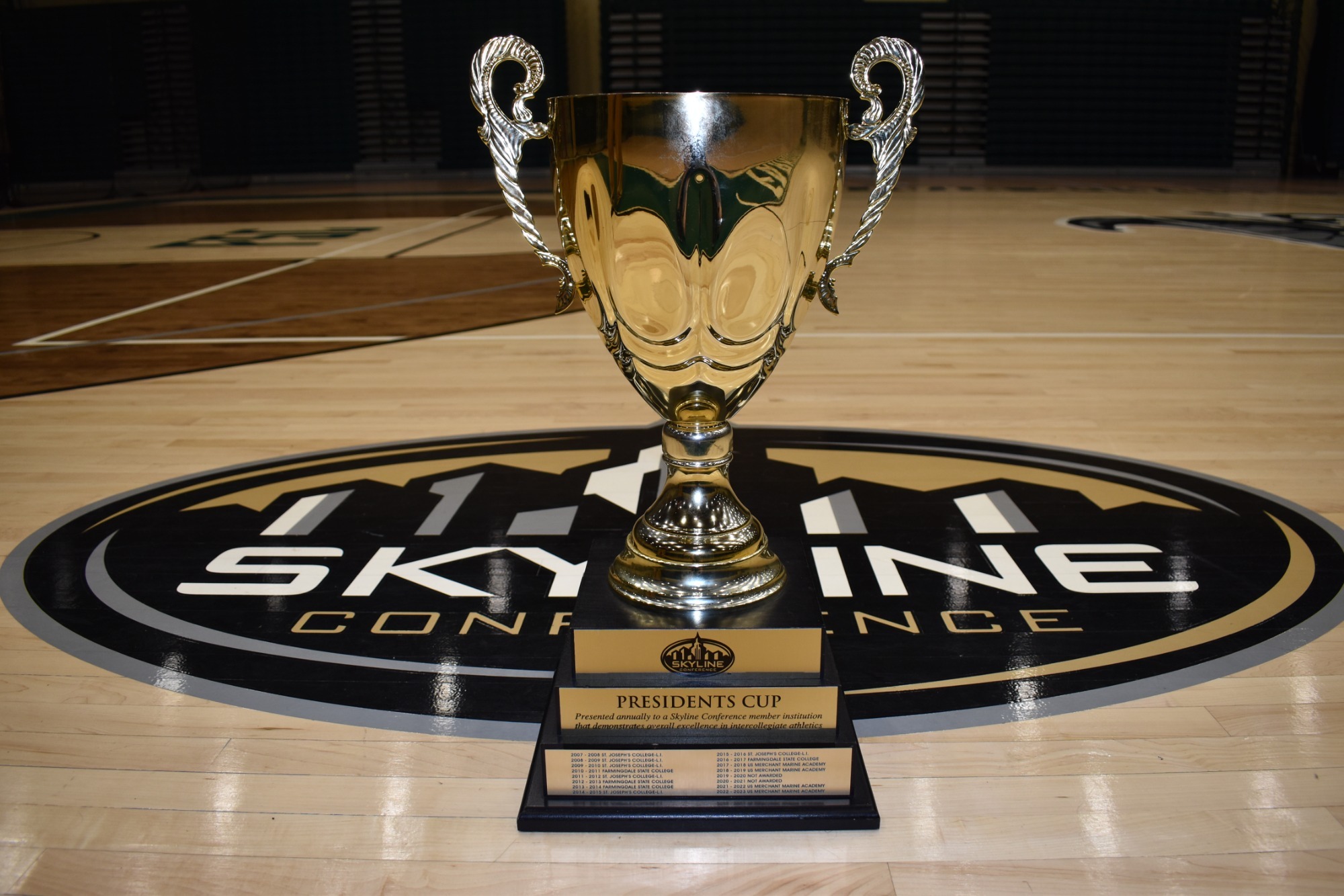2023-24 Skyline Conference Presidents Cup in front of Skyline logo