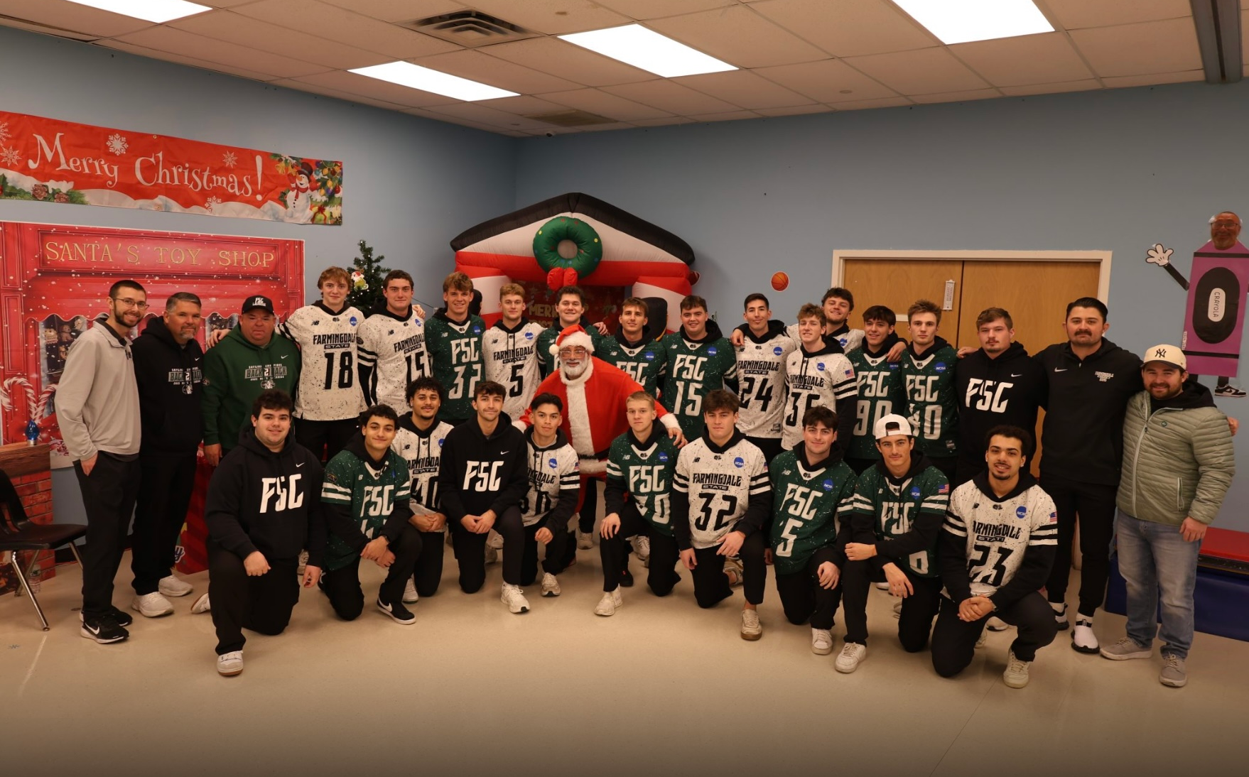 2025 Men's Lacrosse People's Arc visit - team group picture with santa
