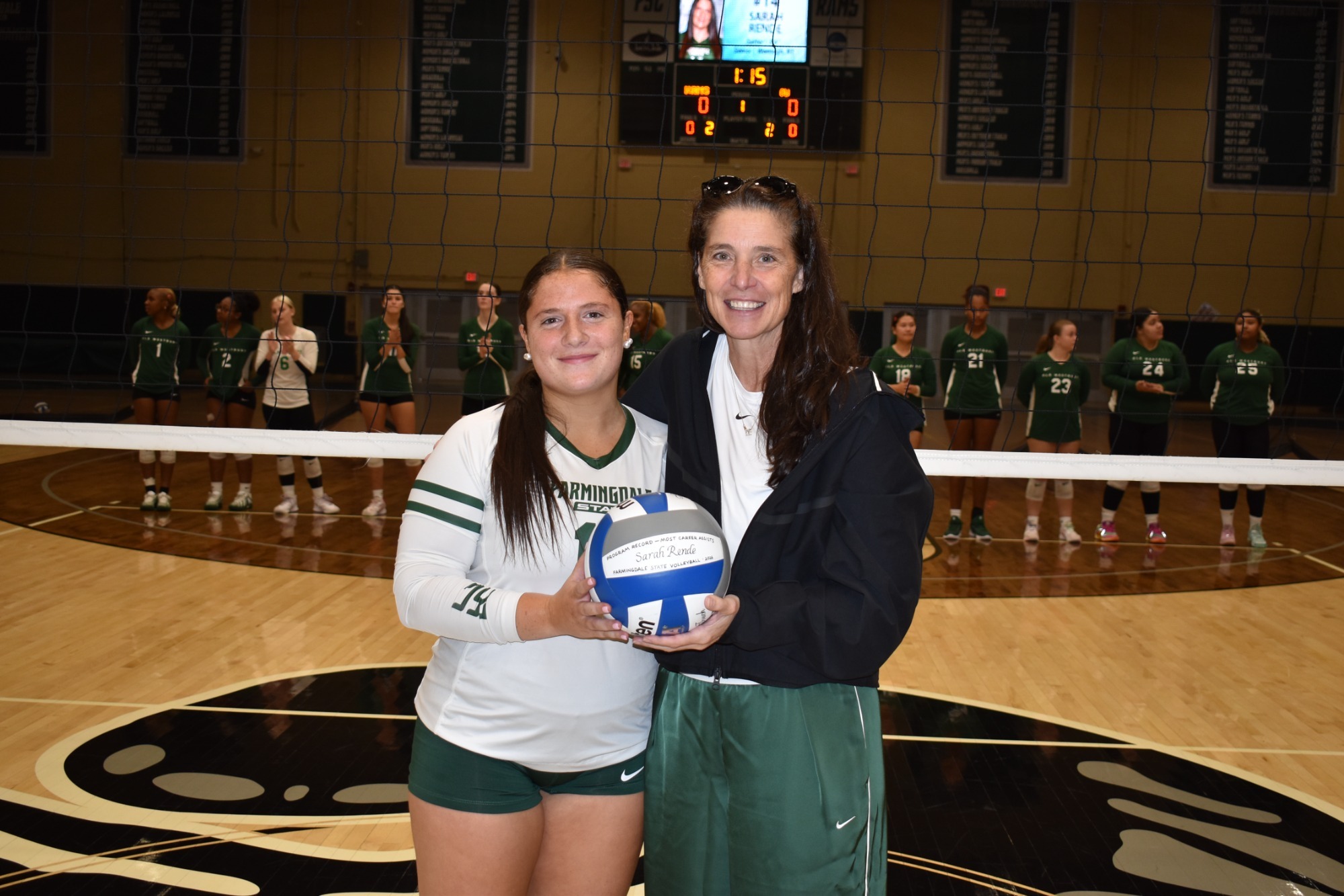 2026 Women's Volleyball - Sarah Rende career assists leader - Picture with Coach Cole