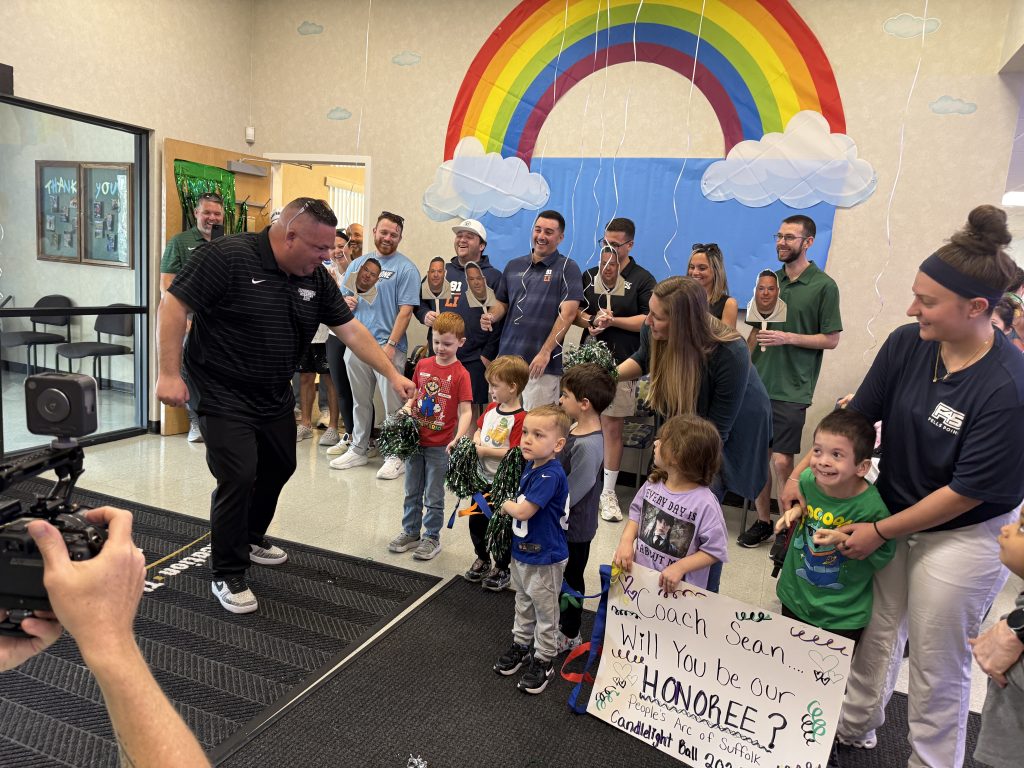 2026 People's Arc of Suffolk - Candlelight Ball honoree - Chamberlain walking into surprise