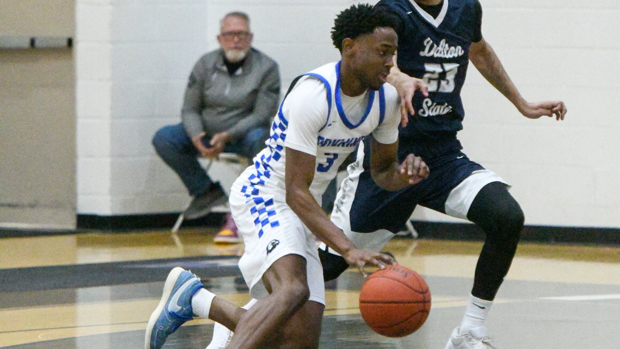 Thomas drives against Dalton