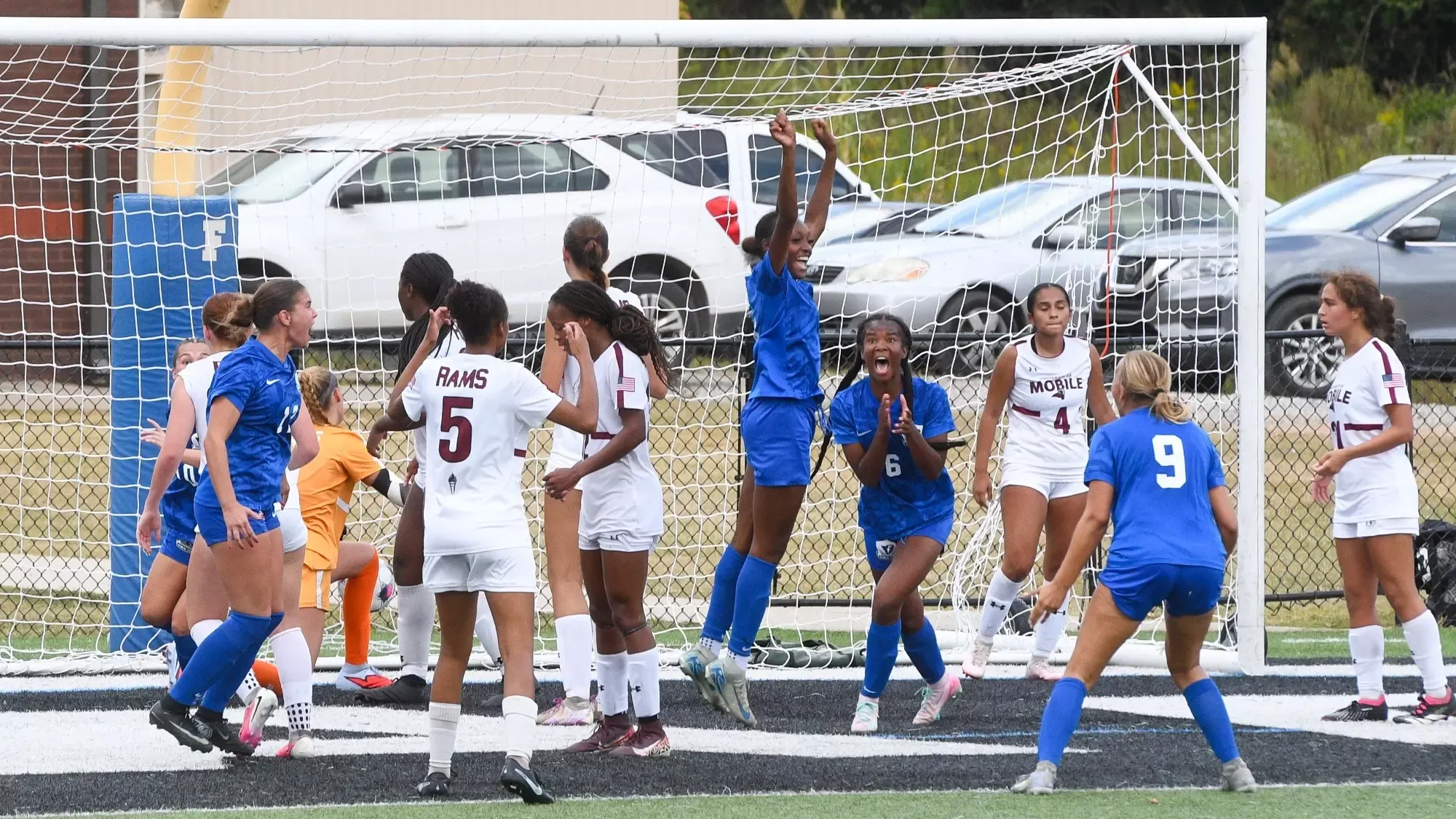Williams and her teammates celebrate an equalizer against Mobile