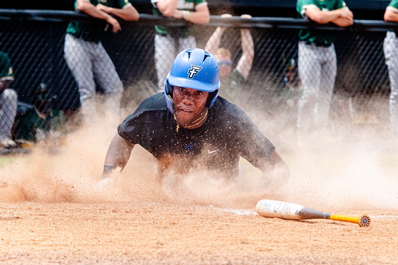 CJ Robertson sliding into home for the second run of the game.