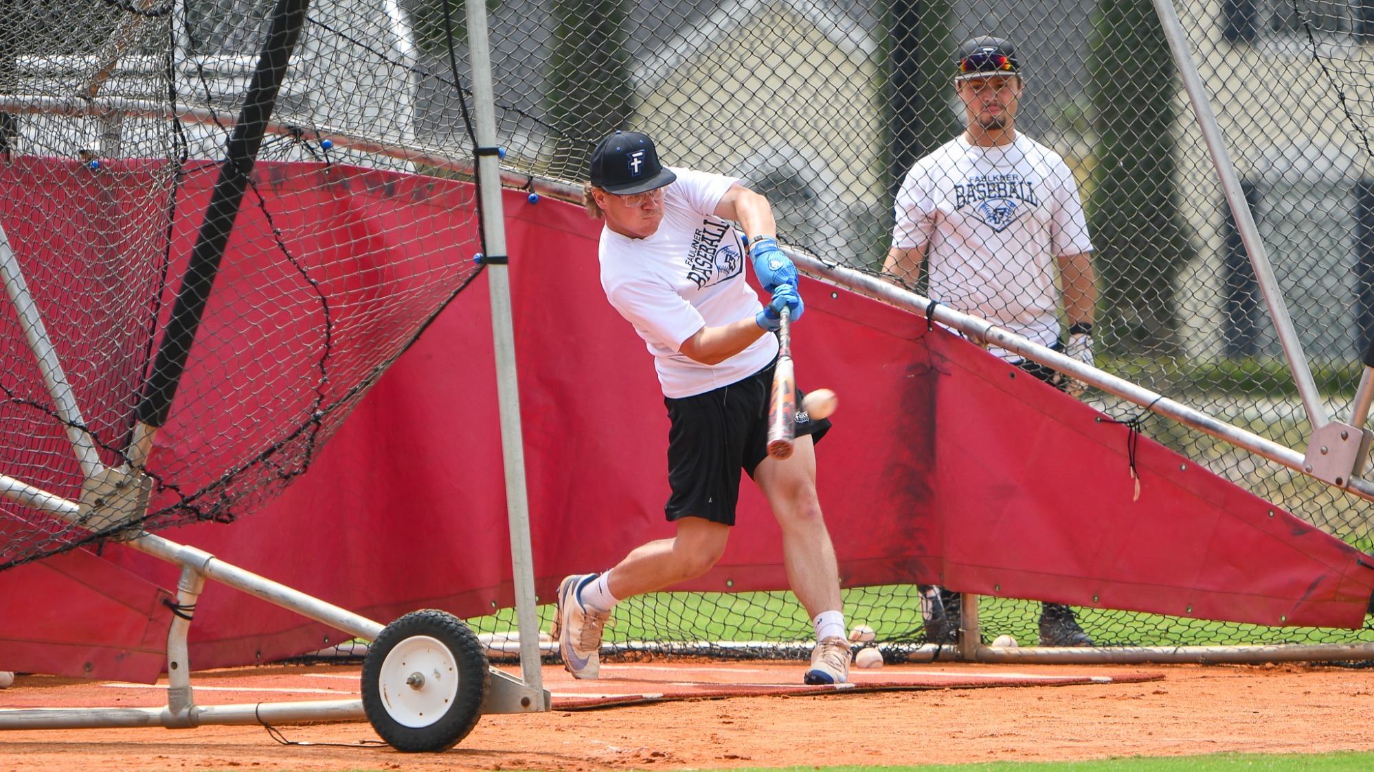 Schellsmidt takes BP swings in preparation for Opening Round