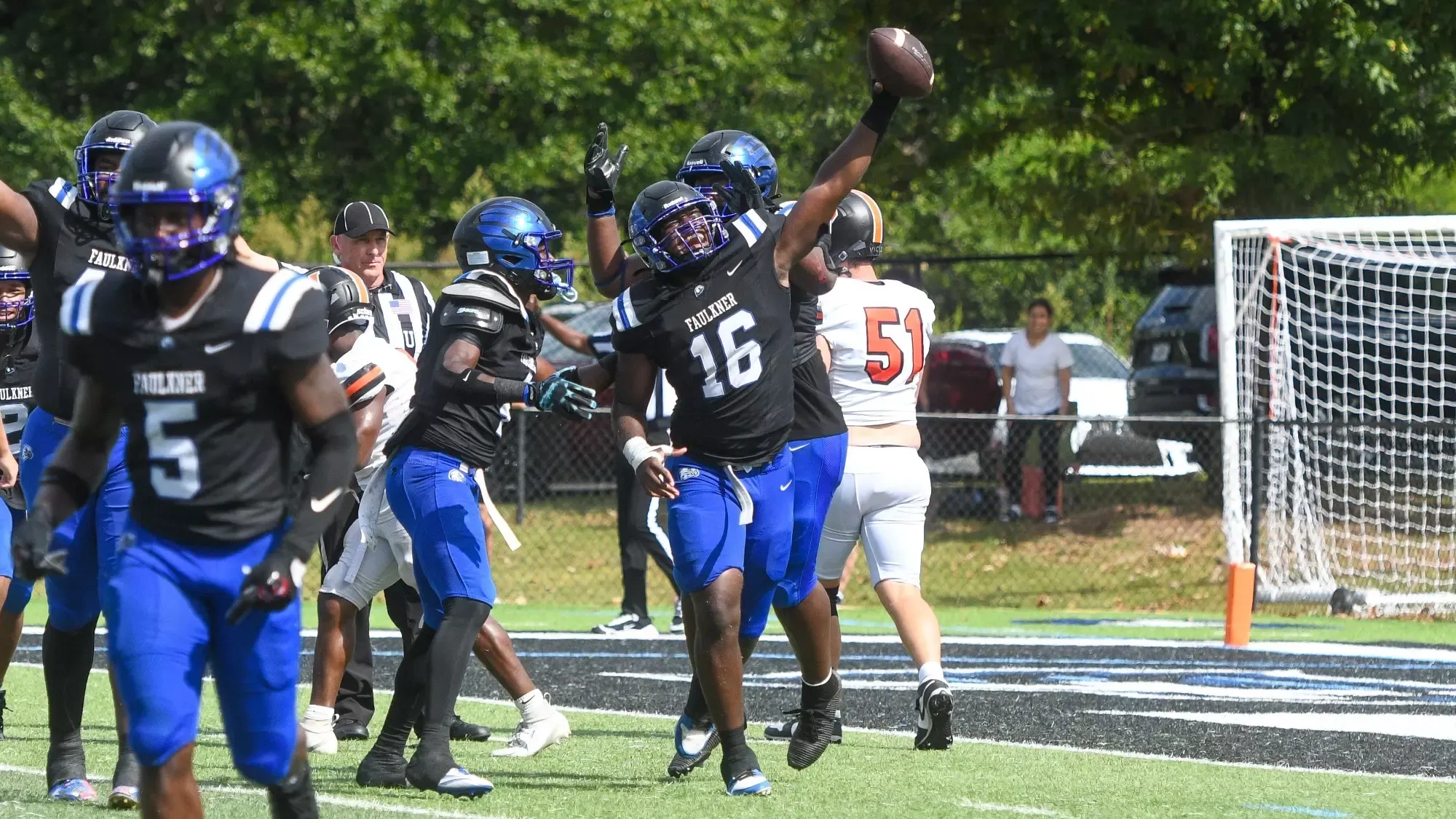 Alozie celebrates recovering a late fumble to preserve the shutout