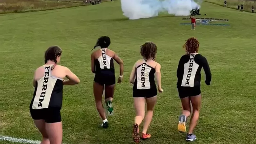 Genesis Pineiro, Erin Reynolds, Arrizona Holiz, and Liza Montgomery in Cross Country action for the Women's Team. 