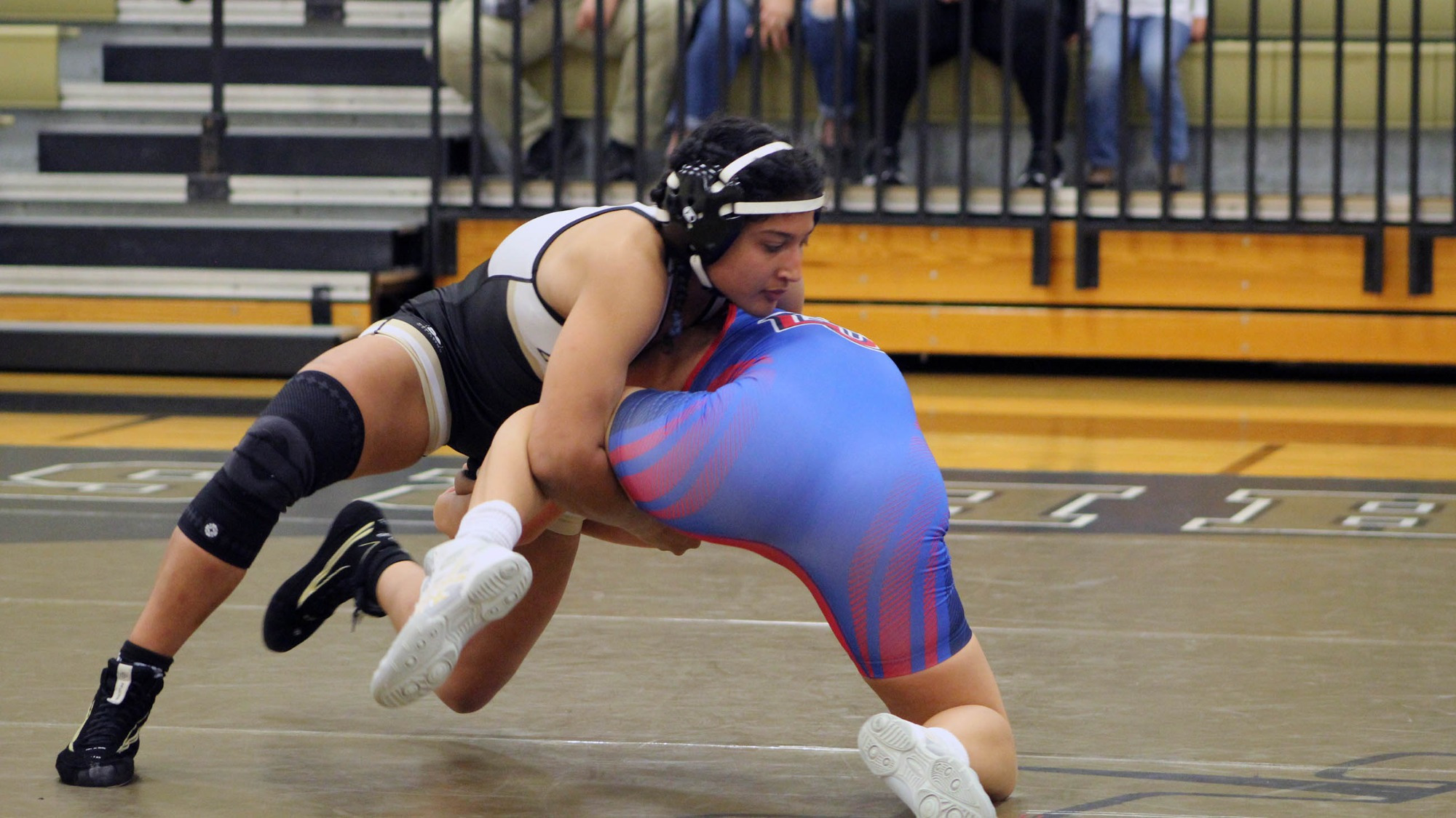 Jazmene Molina cradles her opponent in women's wrestling action during the 2022-23 season. 