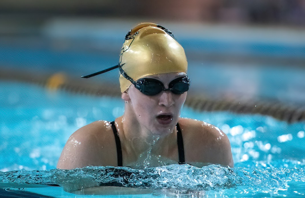 Lauryn Hackett in her swim cap and goggles for the Women's Swimming and Diving team. 