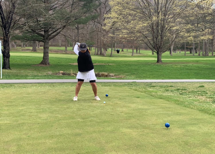 Righty Jiwanan Masoot is in her backswing motion, before she hits the ball from the tee box