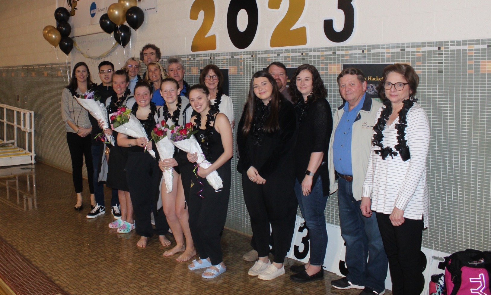 Seniors Lauren Hackett, Liza Montgomery, Jordan Prezio, and Emilie Fairman celebrating their 2022-2023 Senior Night with families.