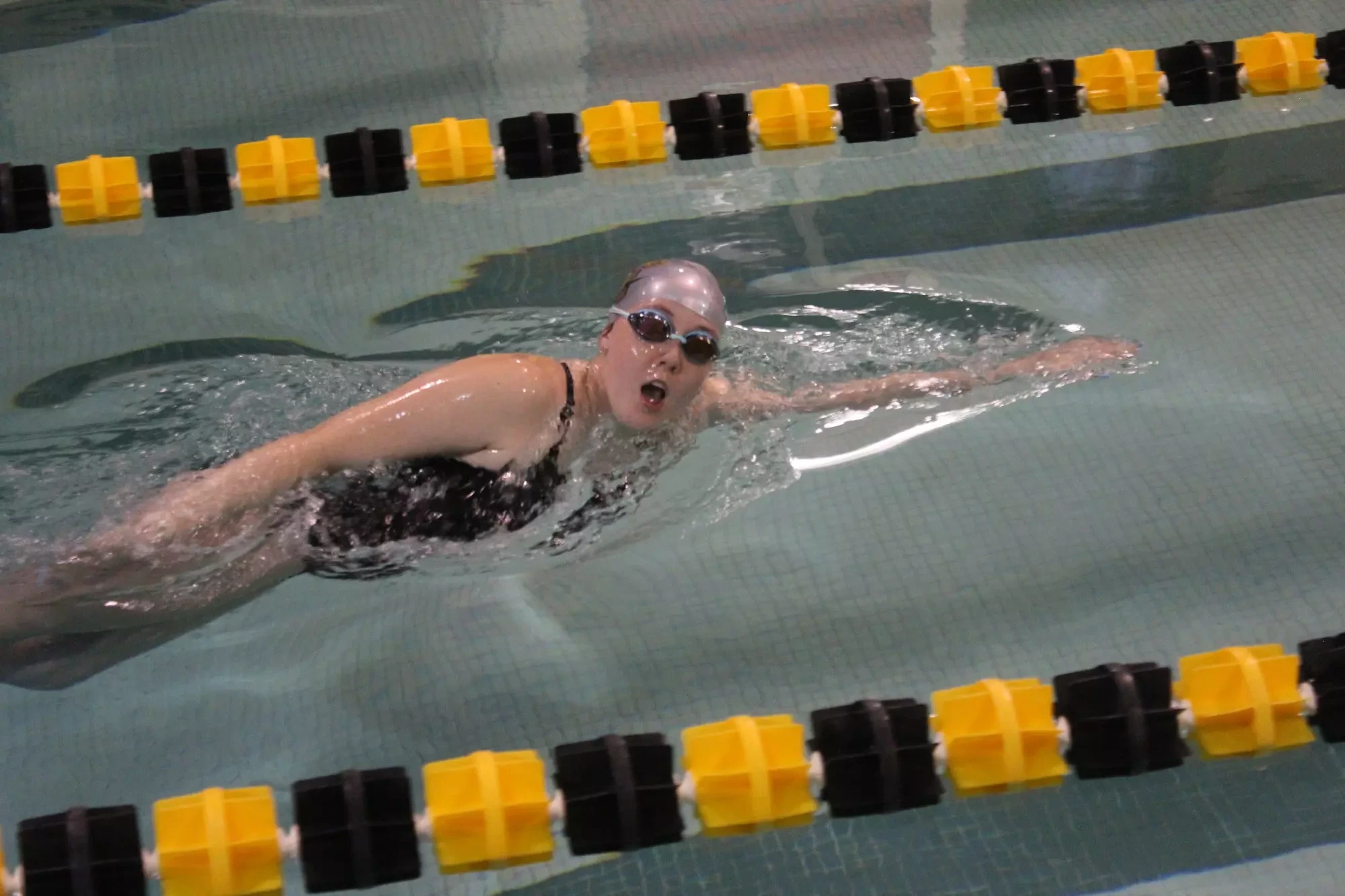 Carley Dye in action for the Ferrum women's swim team in January 2023.