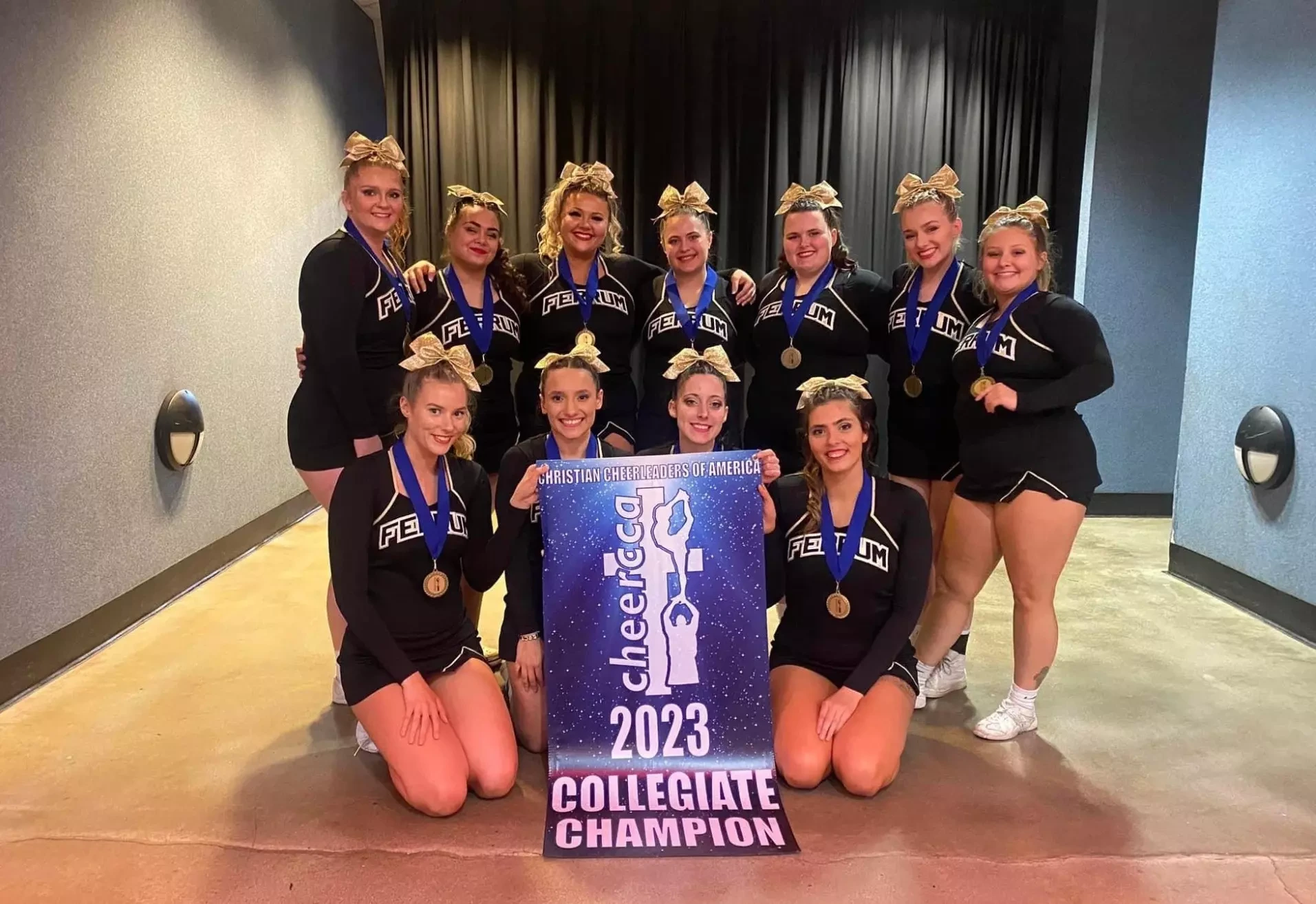 Ferrum's cheer squad with the 2022-23 Christian Cheer Association Championship award.