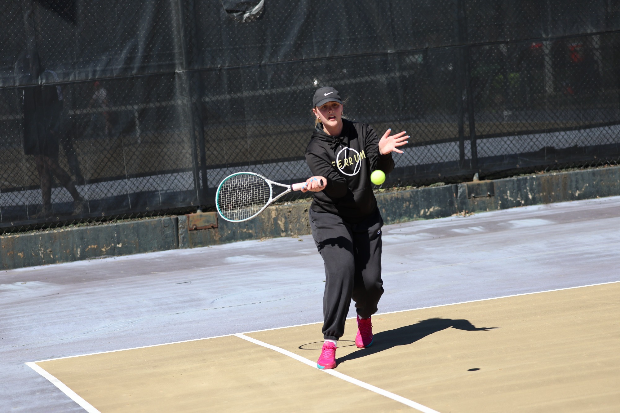 Hannah Huffman readies  herself to hit the tennis ball.