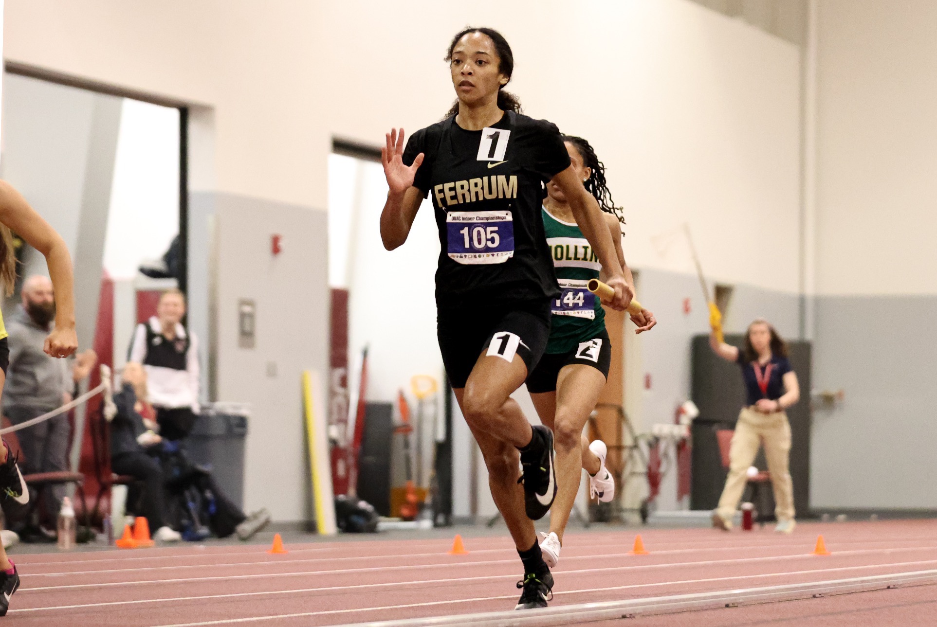 Trina Lewis runs as apart of the relay team at the ODAC indoor Championships.