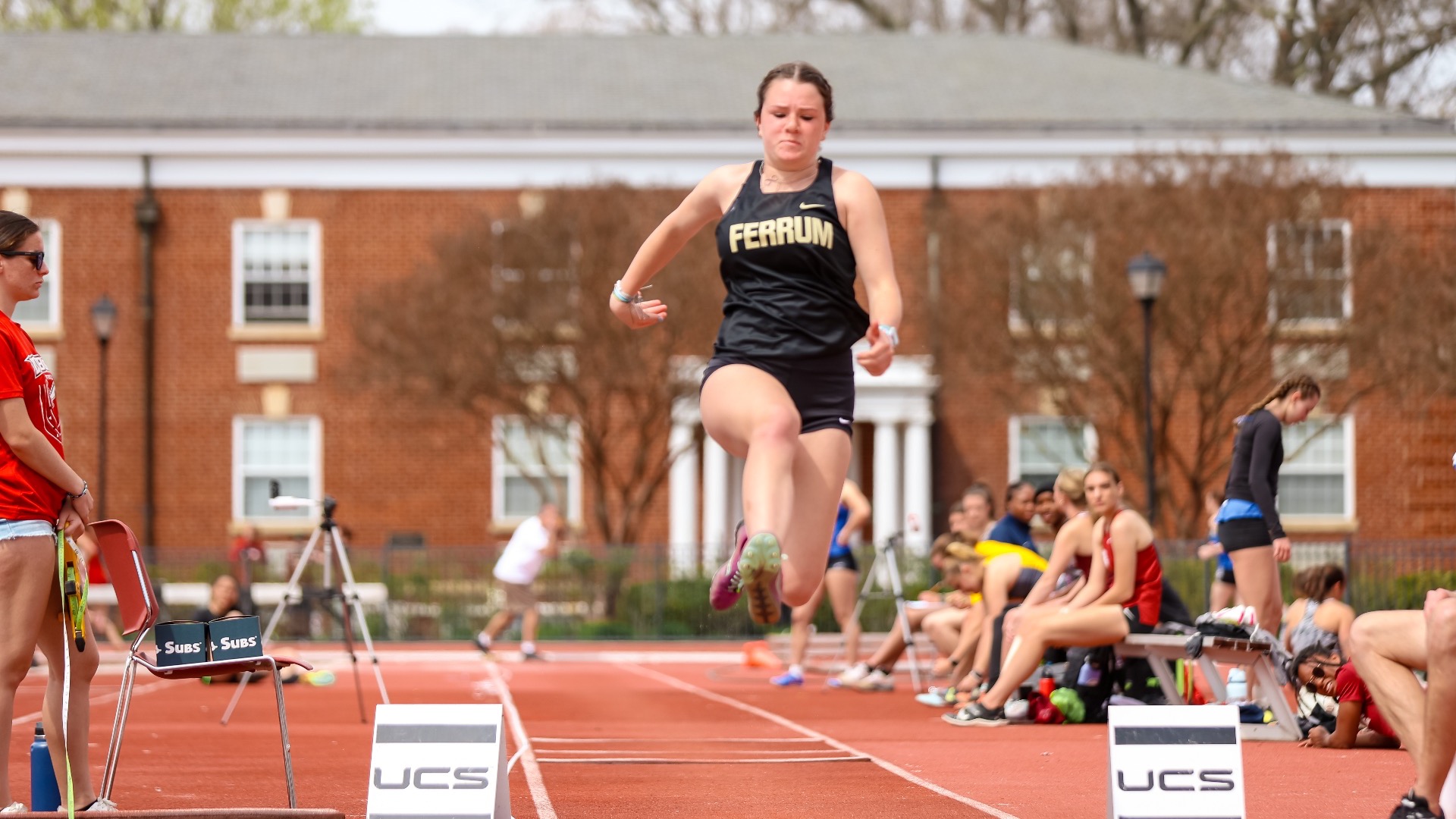 Emma Kelley jumps into the air in the long jump.