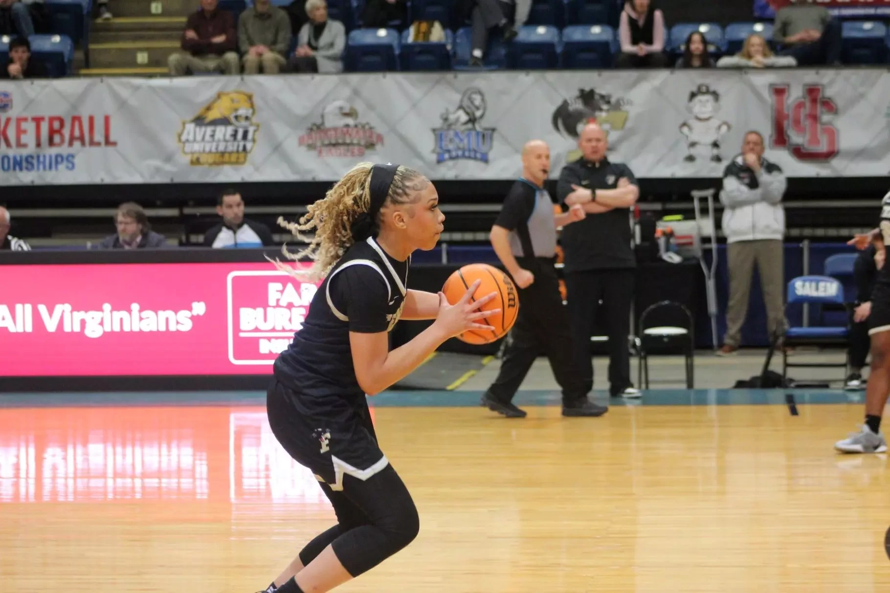 Freshman Kleiauna Riddick looks to drive past W&L defender.