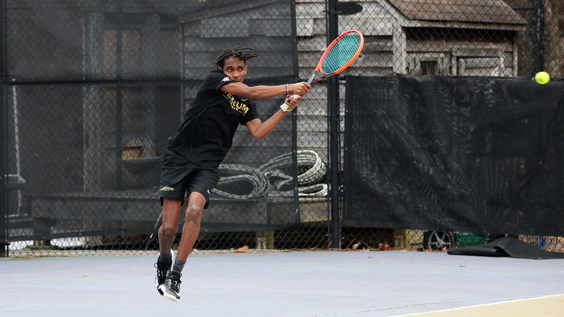 Ferrum's Brian Karenzi hits a backhand.