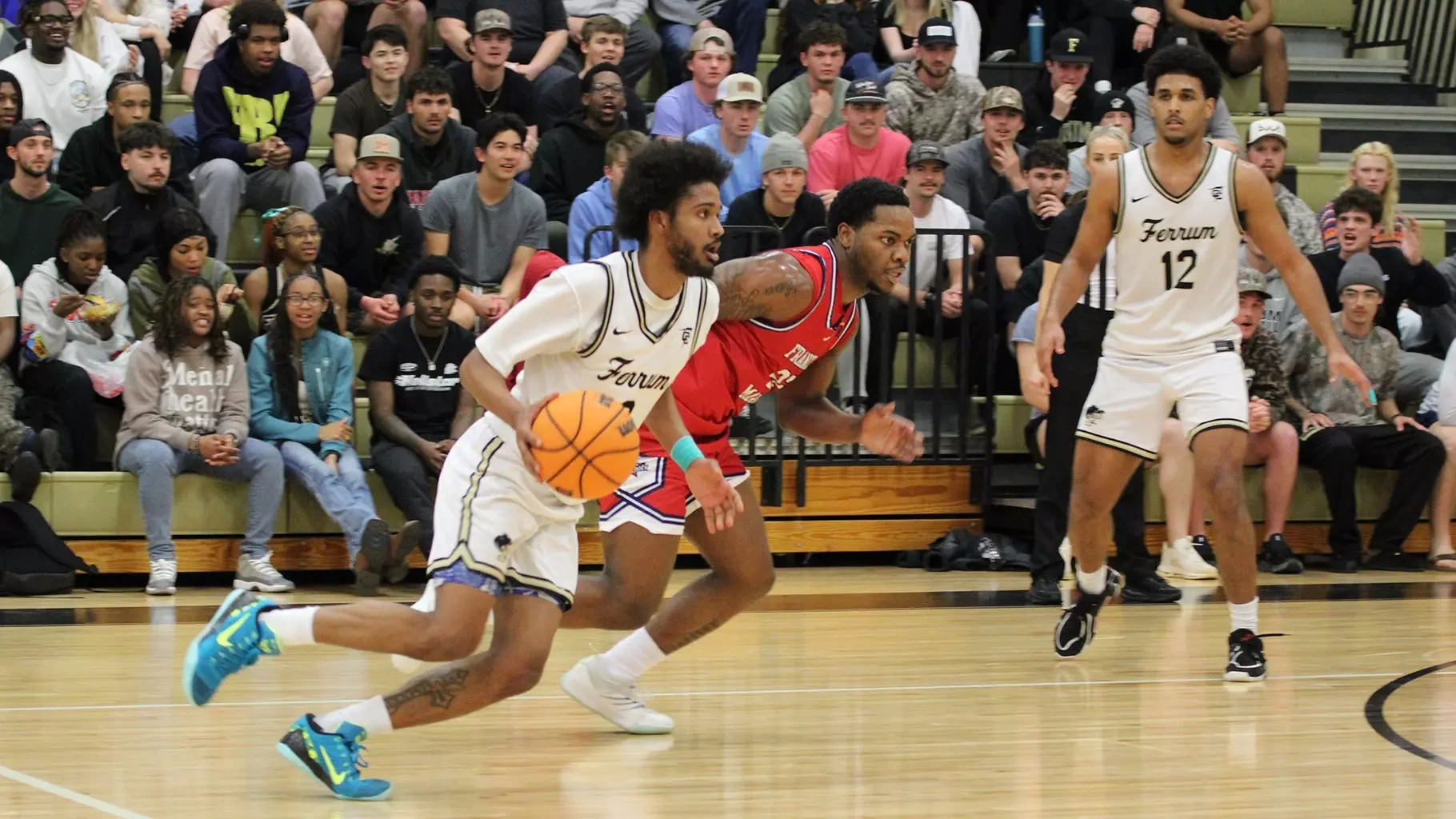 Point guard Rodrigo Farias runs the offense for Ferrum in front of a packed home crowd.