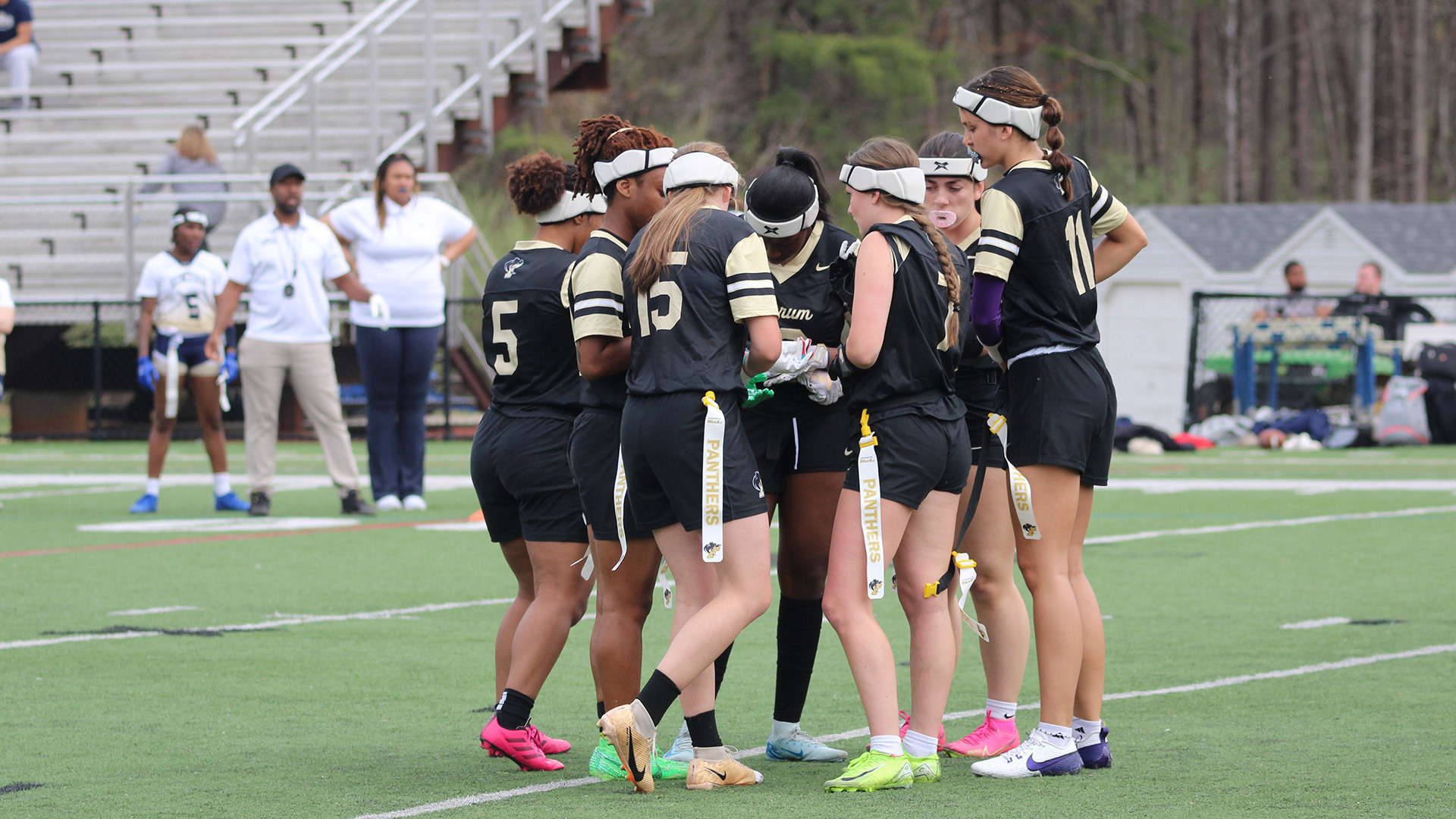 The Panthers huddle up during a home game on March 21, 2026.