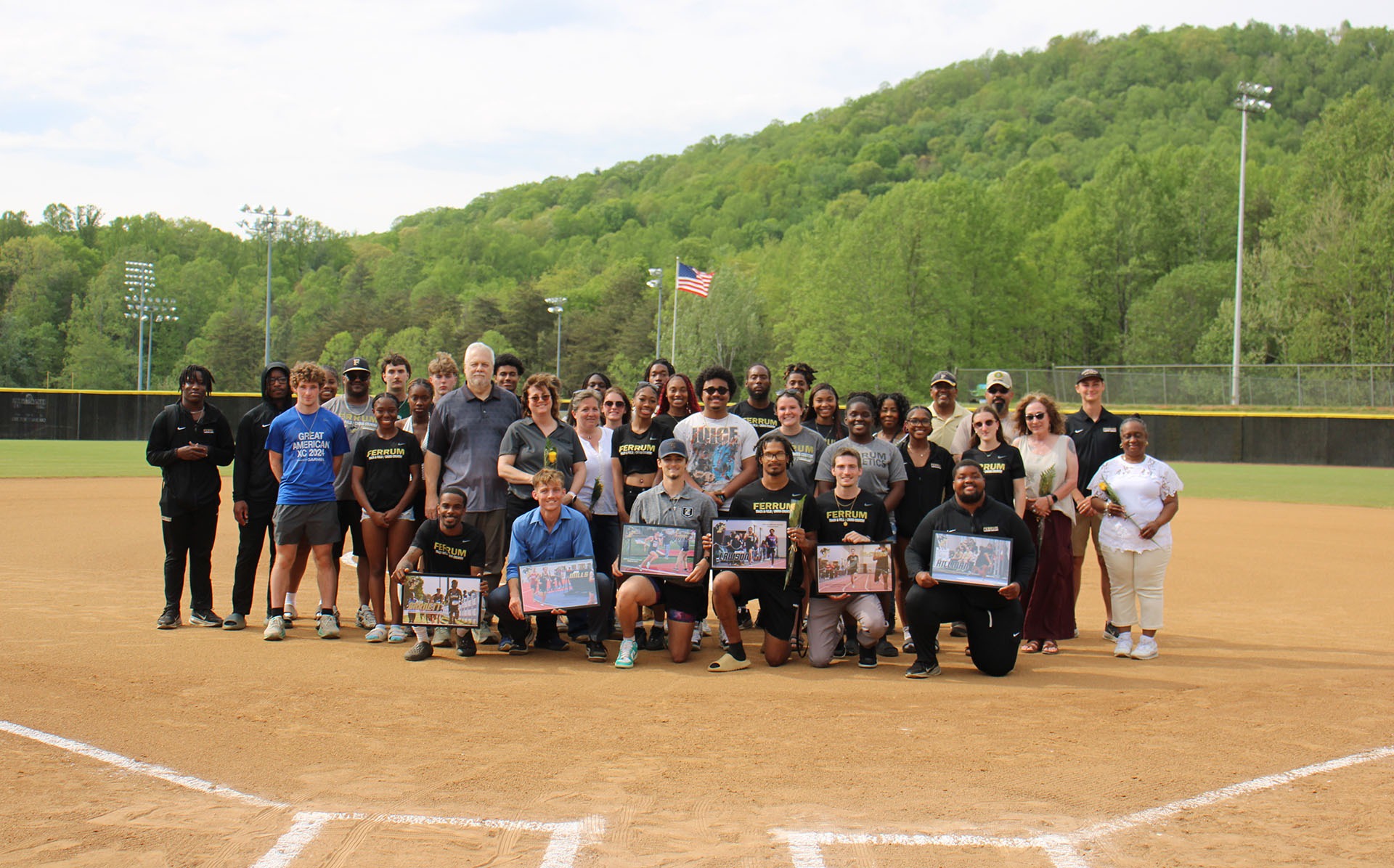 Track honors seniors before softball game.