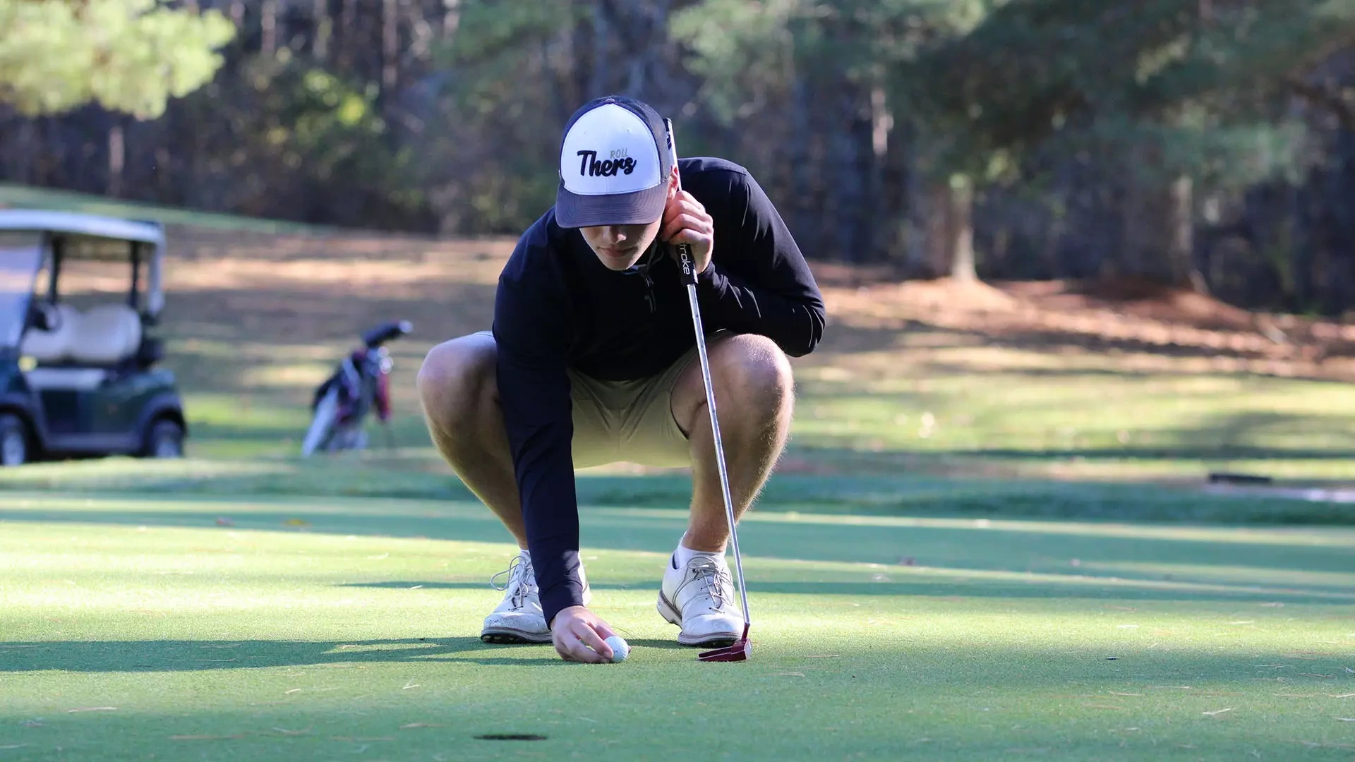 Wyatt Larson lines up a putt during a practice round for the Panthers. 