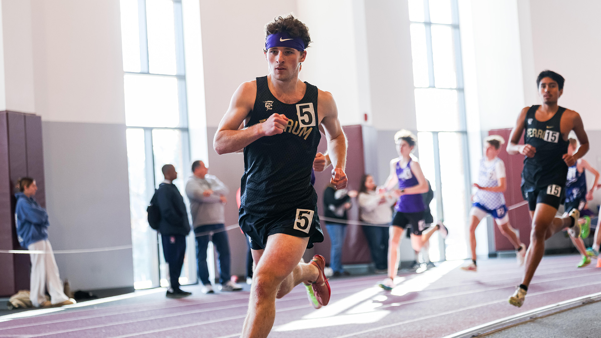 Seth Truett (left) and Carlos Menendez compete during indoor season in January 2026. 
