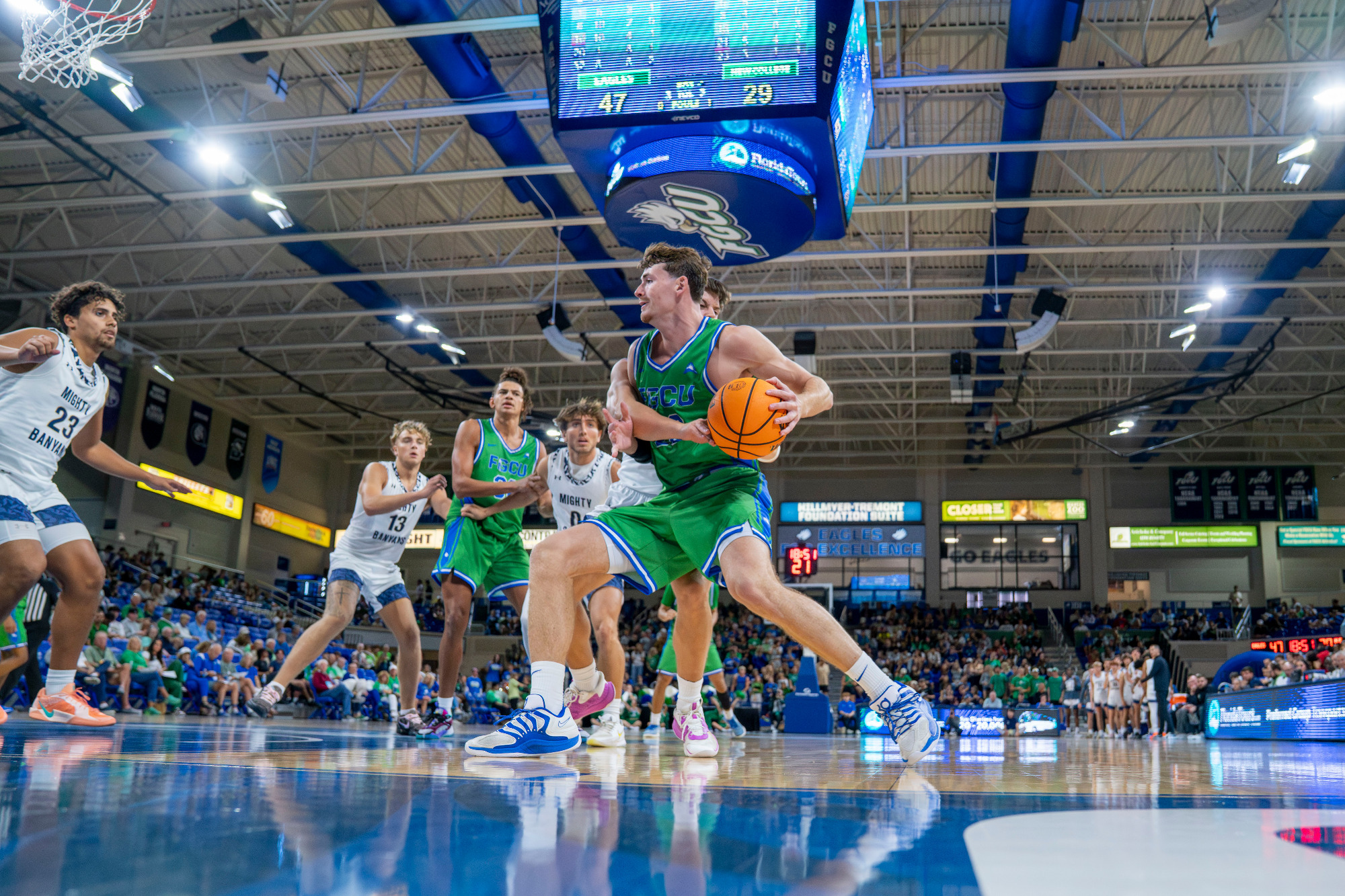 JR Konieczny drives to the basket