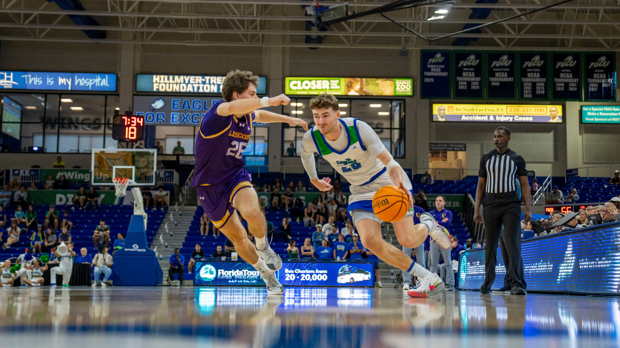 JR Konieczny drives to the basket against Lipscomb