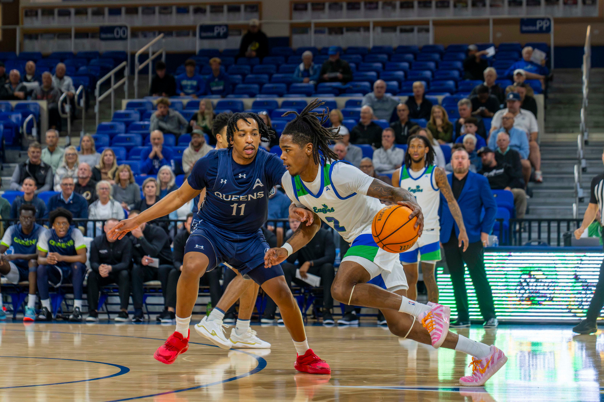 Darren Williams drives to the basket against Queens