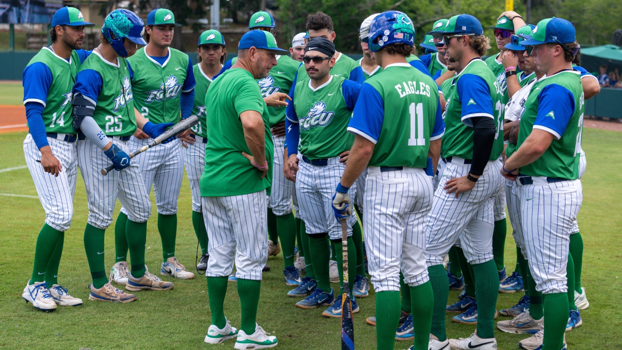 FGCU Head Coach Dave Tollett talks with his team