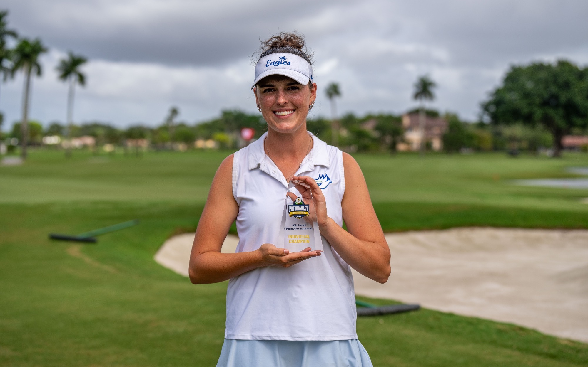 Annie Yost with the Pat Bradley Invitational individual championship trophy