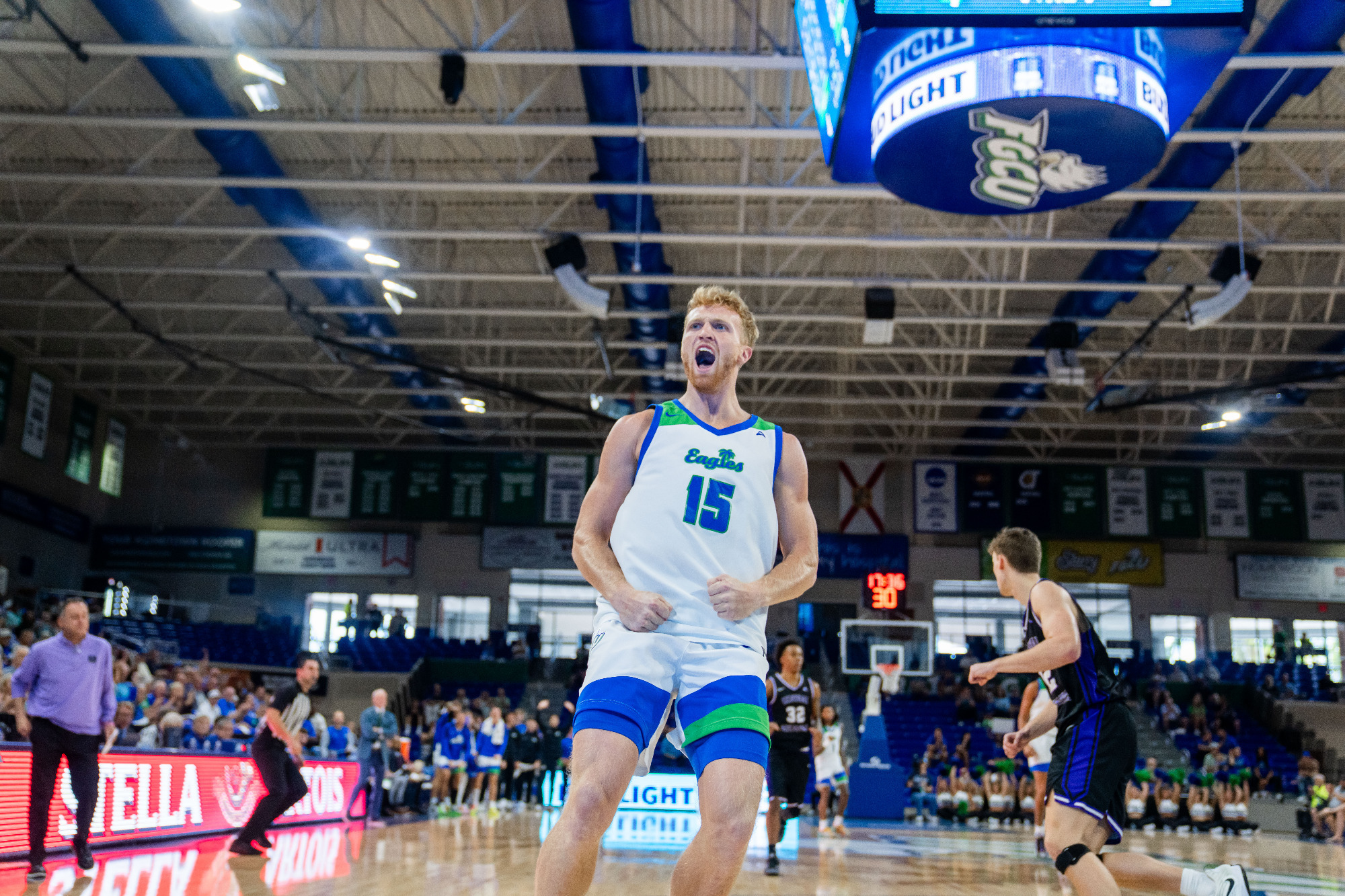 Michael Duax celebrates after a dunk against Central Arkansas