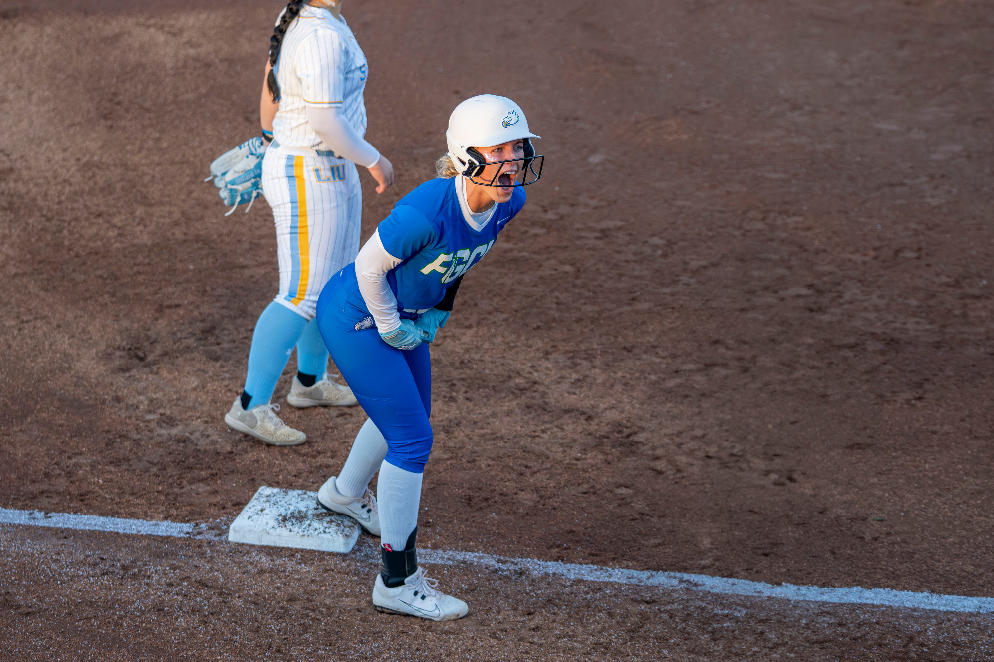 Tiffany Meek celebrates after hitting a bases-clearing triple against Long Island