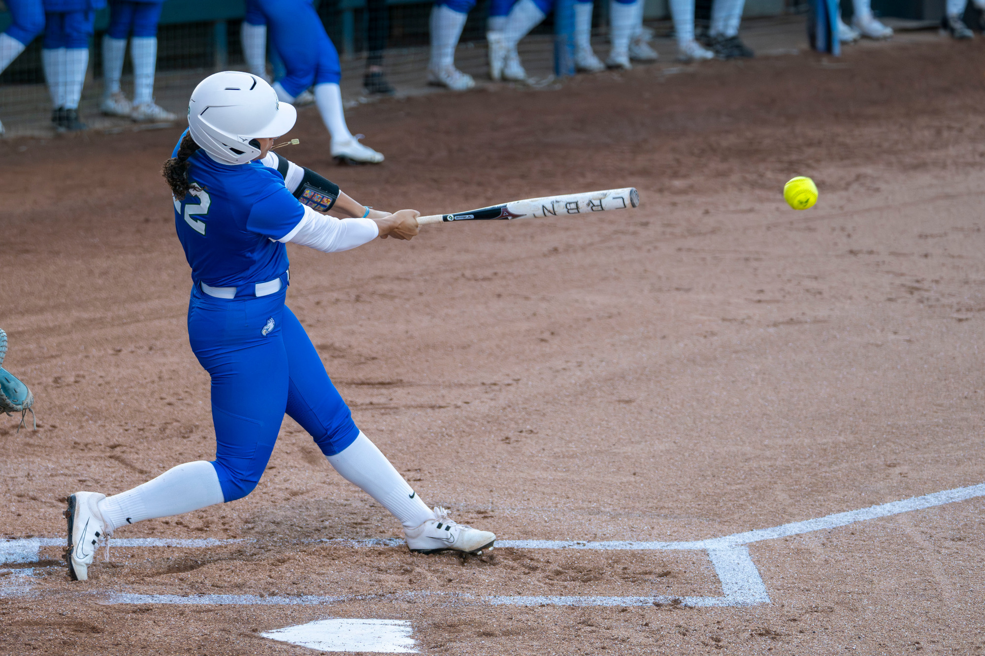 Kiki Daniels drives a ball to the outfield