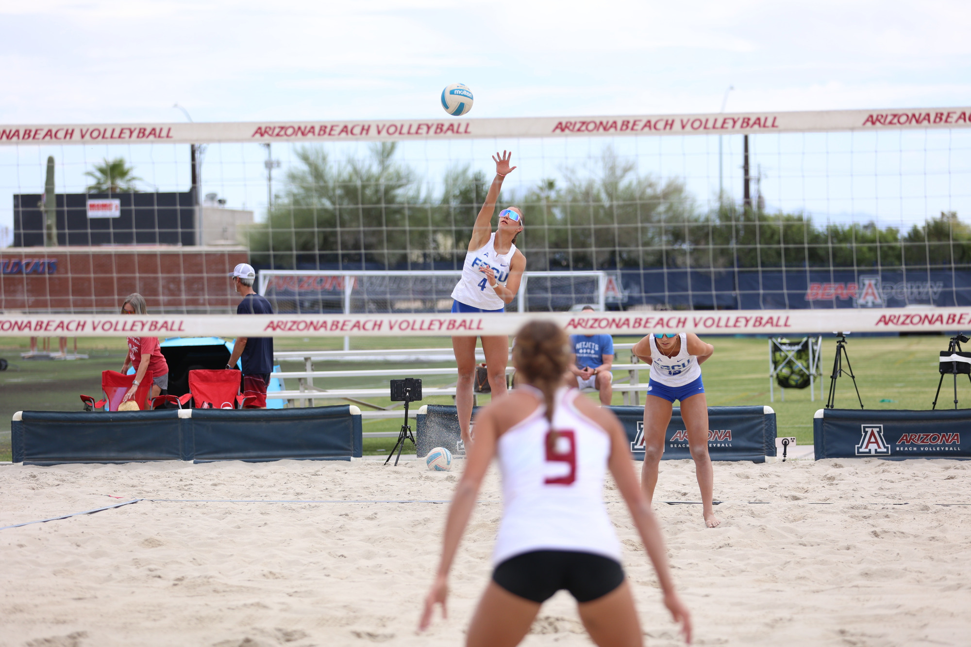 Erin Miller serves against Arizona