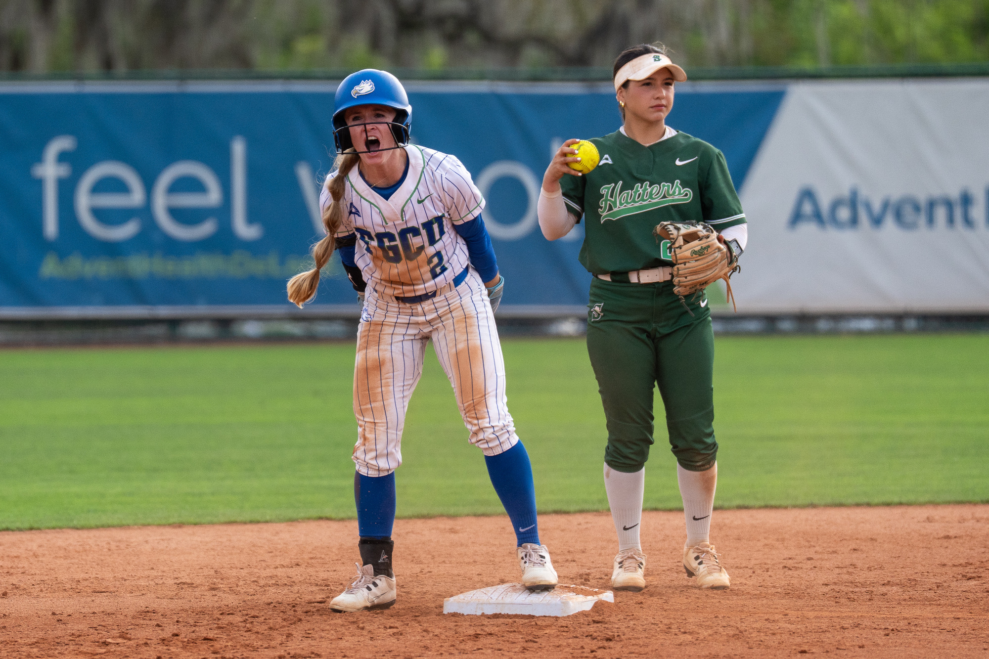 Olivia Black celebrates after hitting a double